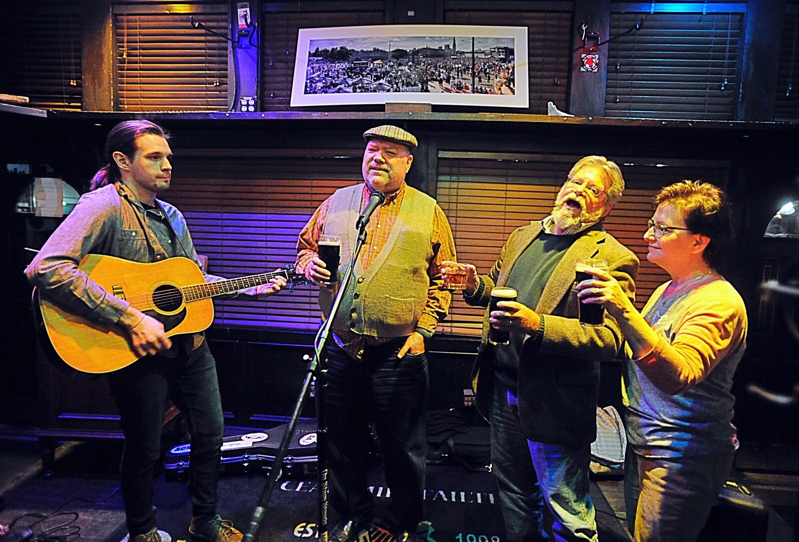 The group Jameson’s Folly played Irish tunes at the Dublin Pub Sunday night as the bar closed at 9 p.m. due to a order by Governor. MARSHALL GORBY/STAFF