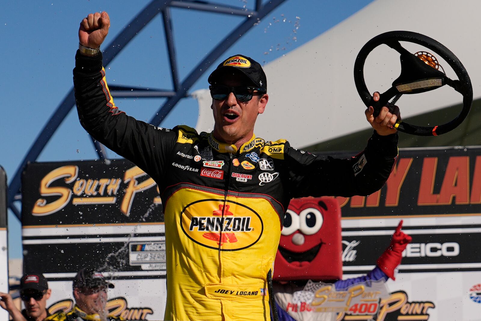 FILE - NASCAR Cup Series driver Joey Logano celebrates after winning a NASCAR Cup Series auto race Sunday, Oct. 20, 2024, in Las Vegas. (AP Photo/John Locher, File)