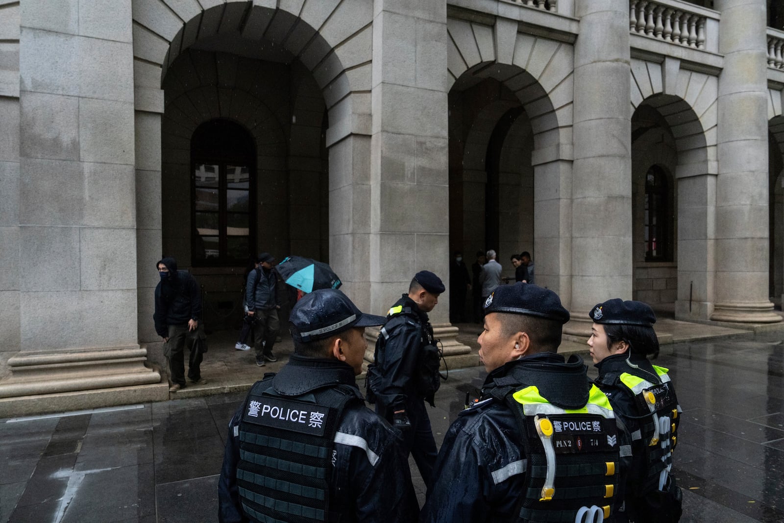 Police officers stand guard outside the Court of Final Appeal in Hong Kong, Thursday, March 6, 2025. Three former organizers of Hong Kong's annual vigil in remembrance of the 1989 Tiananmen Square crackdown won their bid at the top court on Thursday to overturn their conviction over their refusal to provide information to police, marking a rare victory for the city's pro-democracy activists. (AP Photo/Chan Long Hei)