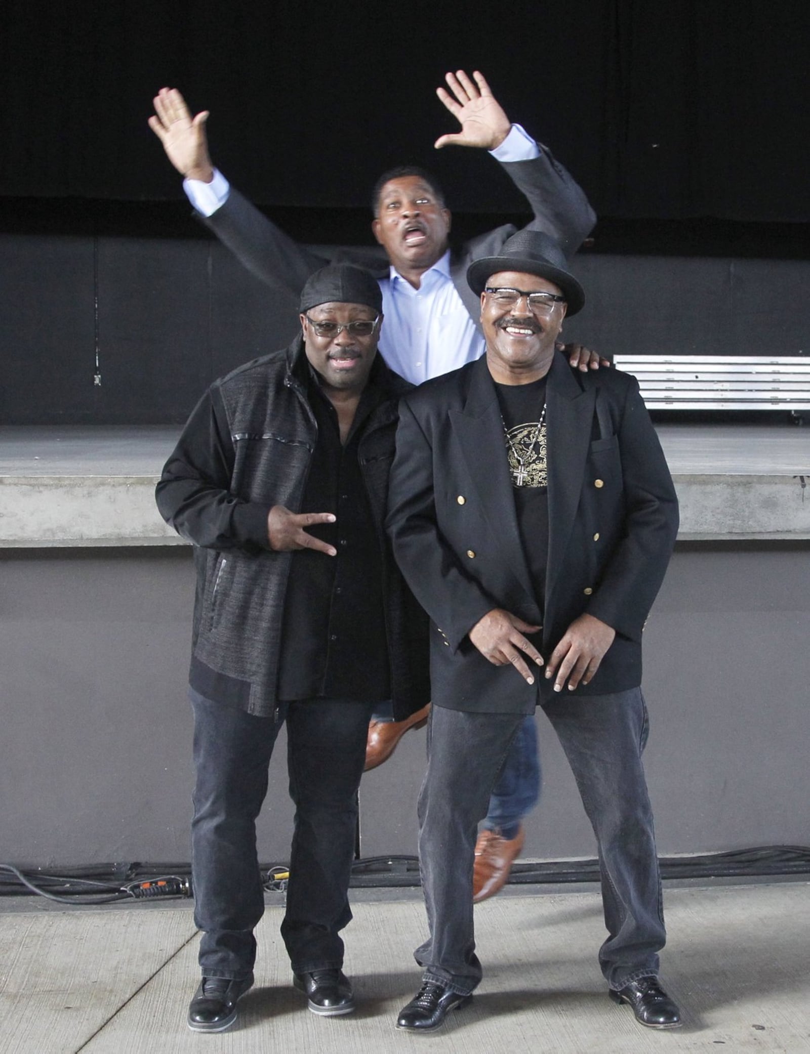 Lester Troutman of Zapp (rear) clowns around with Steve Arrington of Slave (left) and Stephen Shockley of The Original Lakeside (right) at the Rose Music Center at the Heights where they will perform along with other funk music greats in #937-Live, Legends of Relief, a Sept. 18 concert benefiting people impacted by the Memorial Day tornadoes. LISA POWELL / STAFF