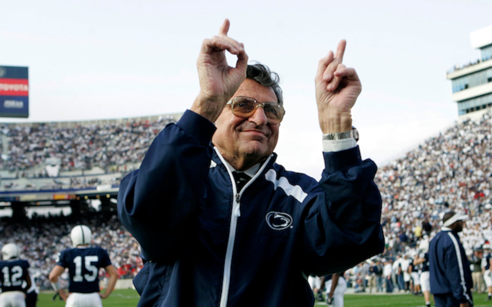 FILE - In this file photo from Nov. 5, 2005,  Penn State football coach Joe Paterno acknowledges the crowd during warm-ups before the NCAA college football game against Wisconsin in State College, Pa.  Paterno, the longtime Penn State coach who won more games than anyone else in major college football but was fired amid a child sex abuse scandal that scarred his reputation for winning with integrity, died Sunday, Jan. 22, 2012. He was 85.  (AP Photo/Carolyn Kaster, File)