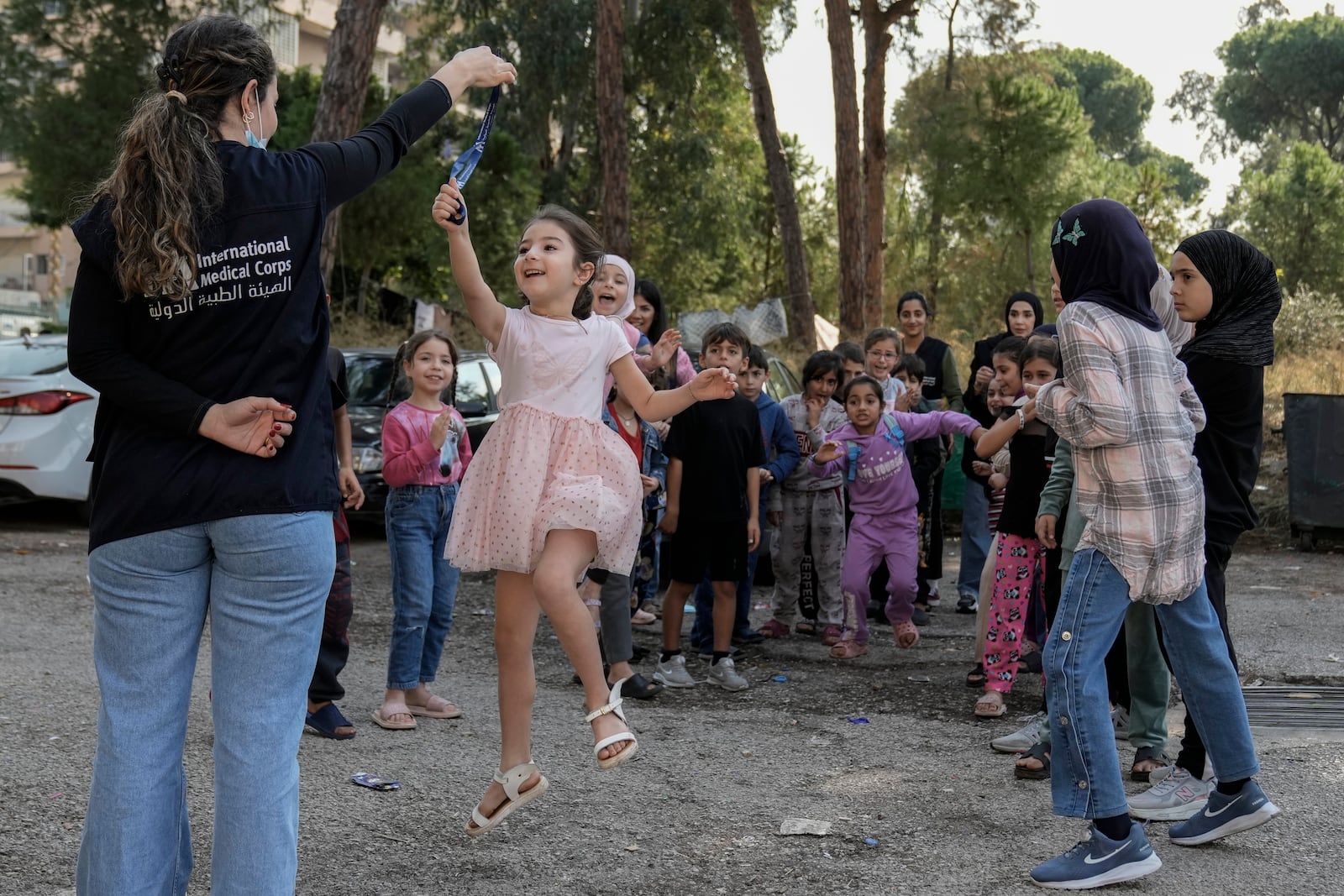 Displaced children take part in activities, organized by the International Medical Corps, at a shelter housing them in Dekwaneh, east Beirut, Lebanon, Thursday, Nov. 7, 2024. (AP Photo/Bilal Hussein)