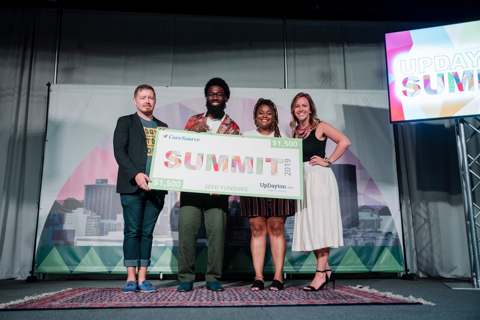 The 11th annual Updayton Summit was held Thursday, Sept. 19 at the Brightside Event Venue.  Baldwin Café   presented by Leroy Bean and  Mariah Johnson  (center) was one of two winning projects.