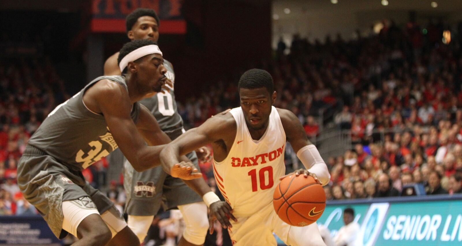 Dayton’s Jalen Crutcher drives against Mississippi States Aric Holman on Friday, Nov. 30, 2018, at UD Arena. David Jablonski/Staff