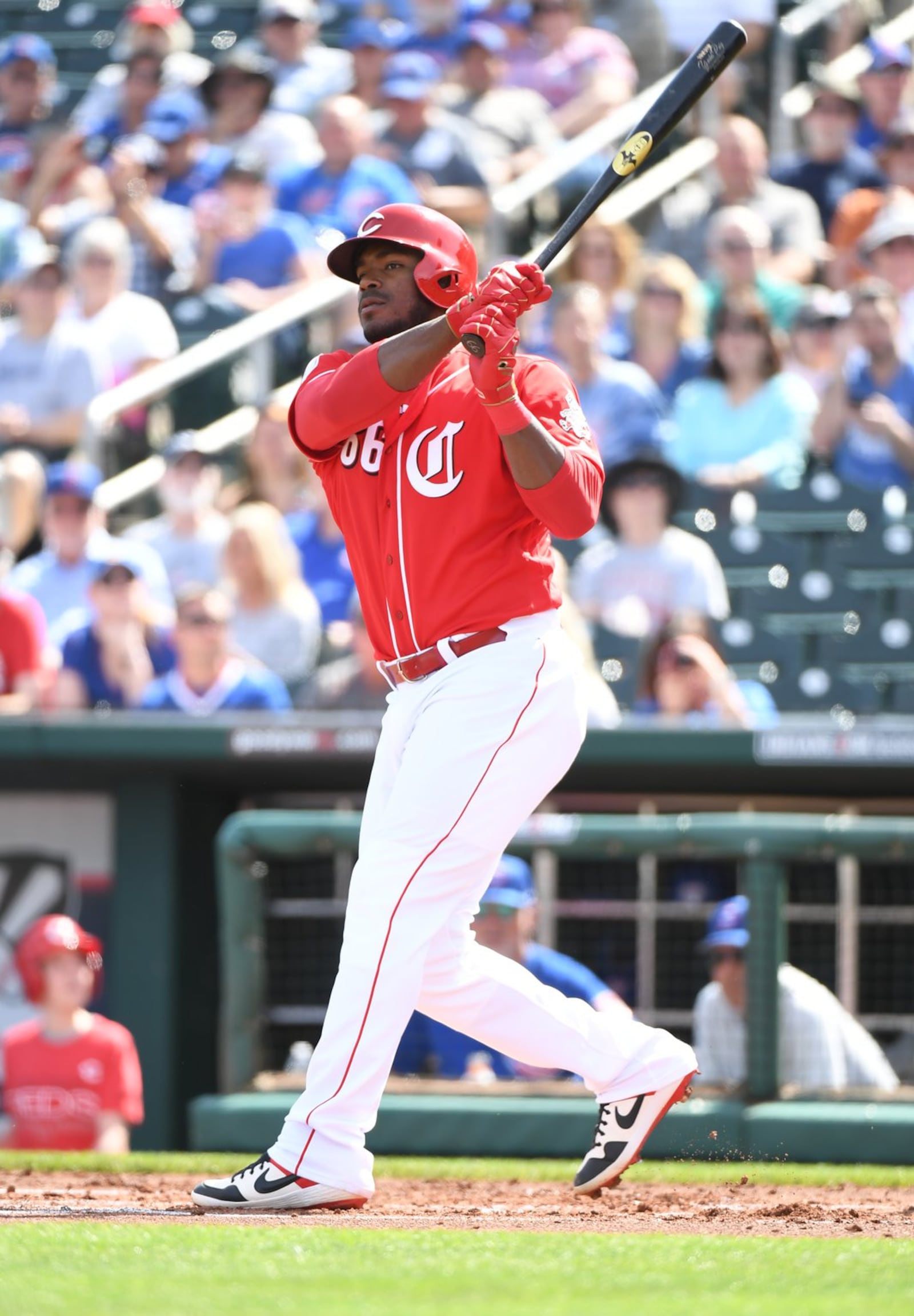 GOODYEAR, ARIZONA - MARCH 04: Yasiel Puig #66 of the Cincinnati Reds follows through on a swing during the first inning of a spring training game against the Chicago Cubs at Goodyear Ballpark on March 04, 2019 in Goodyear, Arizona. (Photo by Norm Hall/Getty Images)