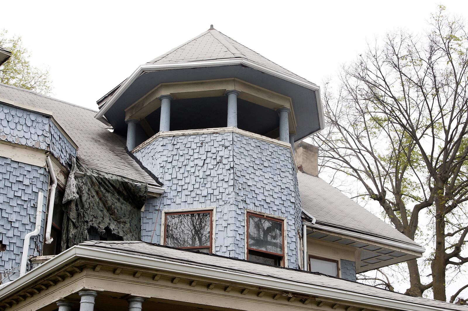 A third-story central tower is featured on the home at 815 W. Grand Ave. in Dayton that was once the residence leased by James M. Cox in the years before he became Ohio governor. LISA POWELL / STAFF