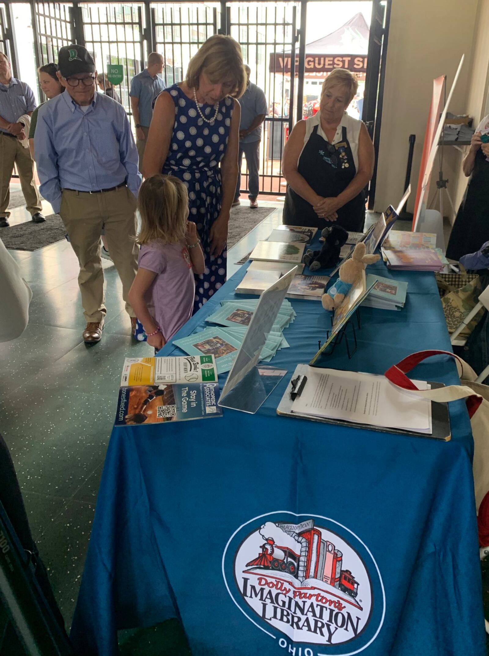 Ohio Gov. Mike DeWine and Ohio First Lady Fran DeWine at an enrollment booth for Dolly Parton's Imagination Library of Ohio during the Dayton Dragons game on Aug. 14, 2022. CONTRIBUTED\DOLLY PARTON'S IMAGINATION LIBRARY OF OHIO