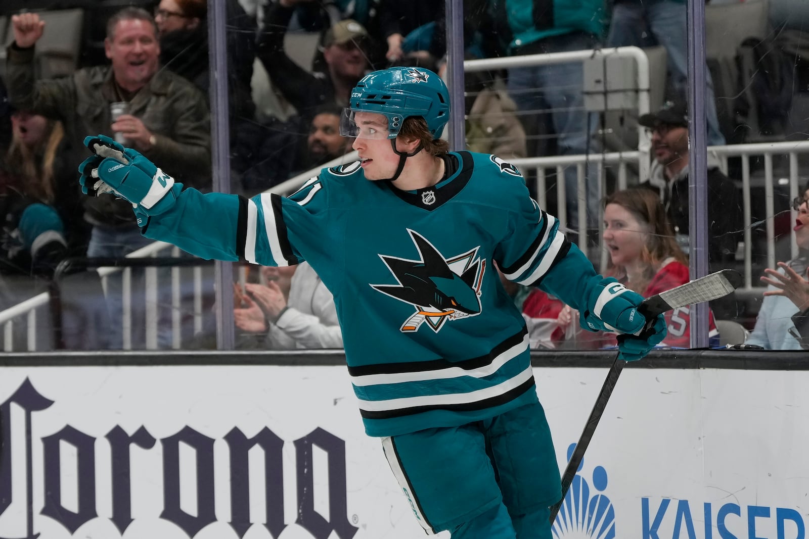 San Jose Sharks center Macklin Celebrini celebrates after scoring against the Montreal Canadiens during the first period of an NHL hockey game in San Jose, Calif., Tuesday, Feb. 4, 2025. (AP Photo/Jeff Chiu)