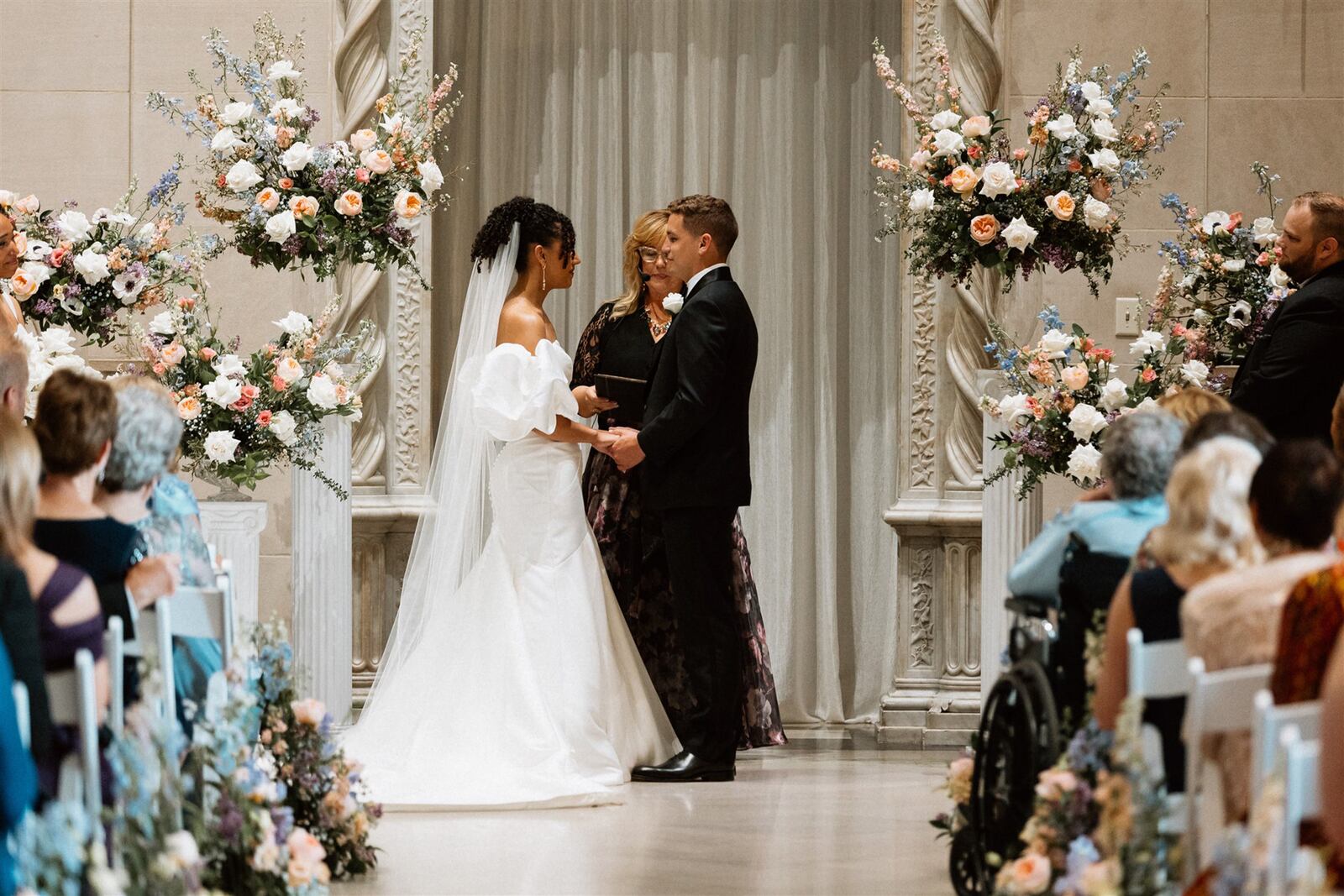 GeNell's created floral arrangements for Carli Goode and Ben Reis's wedding ceremony at the Dayton Art Institute. The family flower business has built personal relationships with many customers over the years.