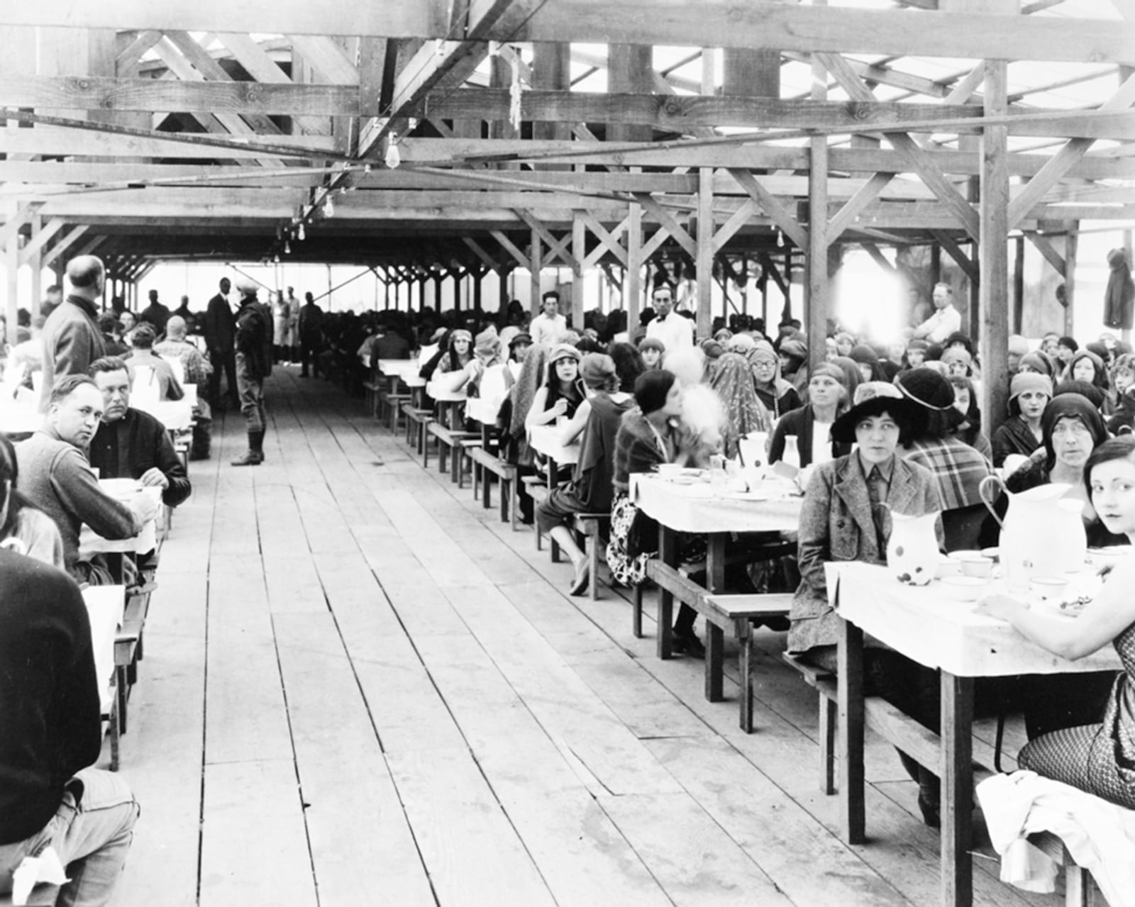 "The Ten Commandments" extras (some in costumes) and crew members eat a meal at ‘Camp DeMille’ on location at the Nipomo Dunes, Guadalupe, Calif. in 1923. PARAMOUNT PICTURES