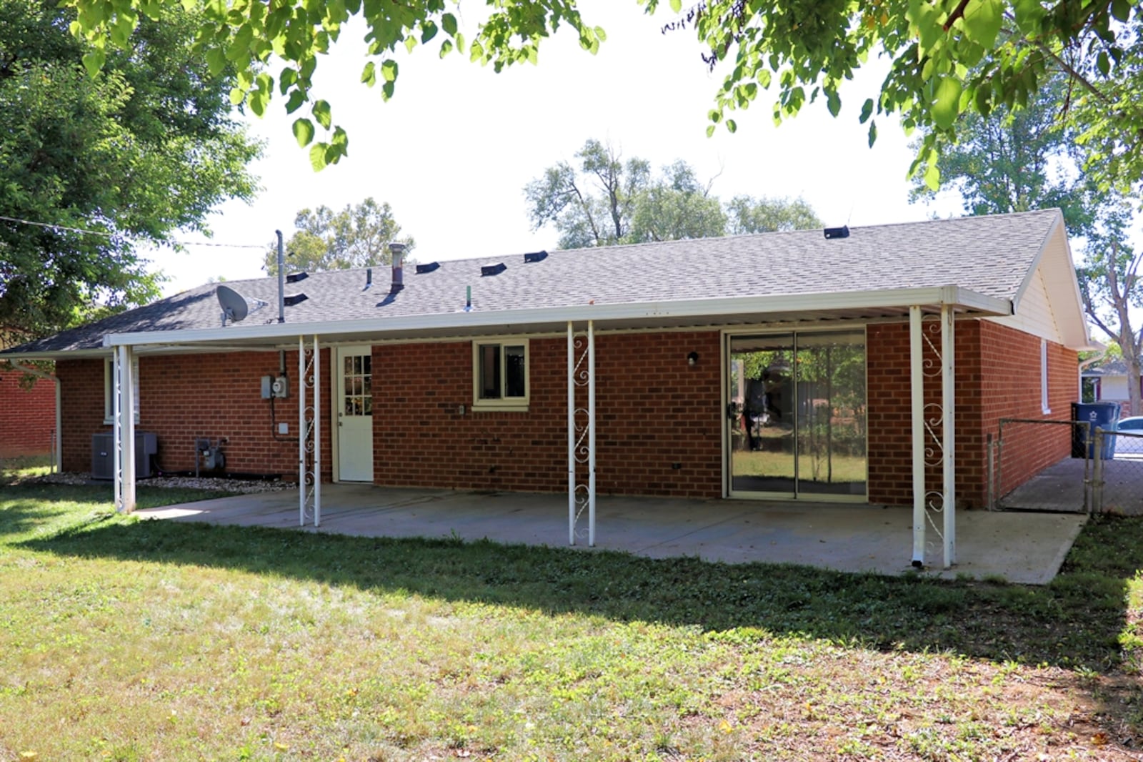 Sliding patio doors open off the dining room to the spacious covered patio.