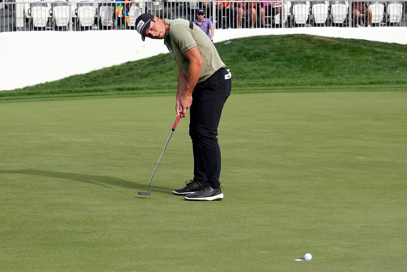 Viktor Hovland, of Norway, watches his putt on the 17th green go in the hole for a birdie during the final round of the Valspar Championship golf tournament Sunday, March 23, 2025, at Innisbrook in Palm Harbor, Fla. (AP Photo/Chris O'Meara)