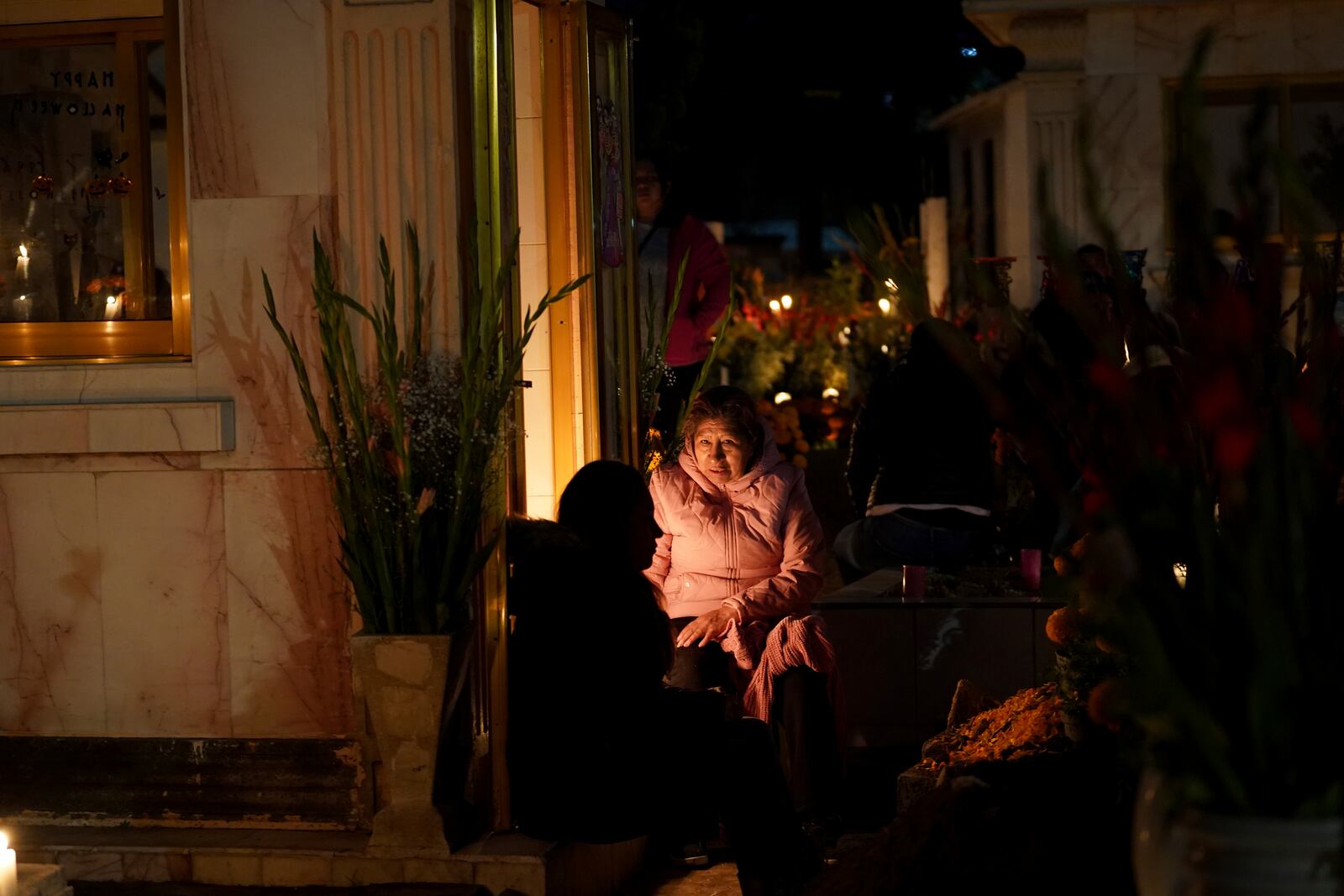 Families gather to keep company with their dearly departed, celebrating Day of the Dead, at the San Gregorio Atlapulco cemetery on the outskirts of Mexico City, Friday, Nov. 1, 2024. (AP Photo/Moises Castillo)