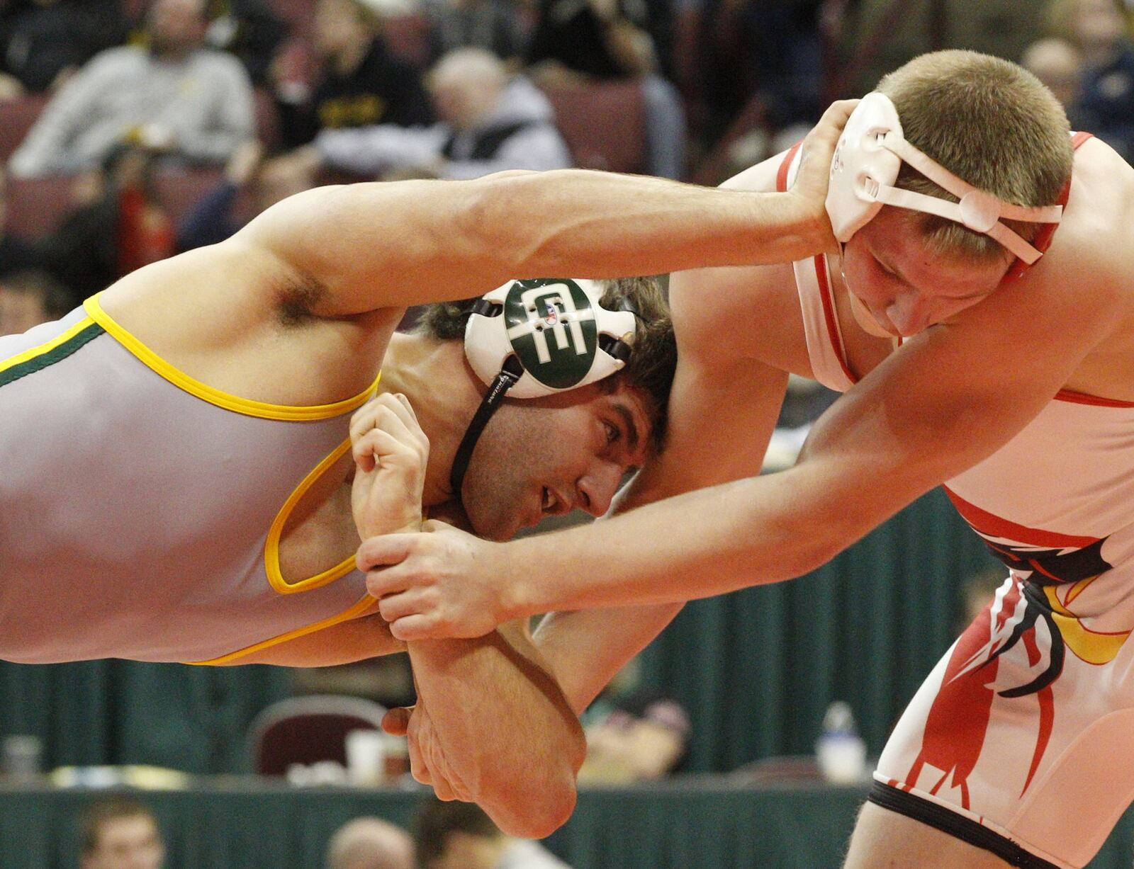 B.J. Toal of Troy Christian (left) decisioned Sam Groff of Magnolia Sandy Valley to win his second straight D-III 182-pound state title in 2013 at the Jerome Schottenstein Center in Columbus. STAFF FILE