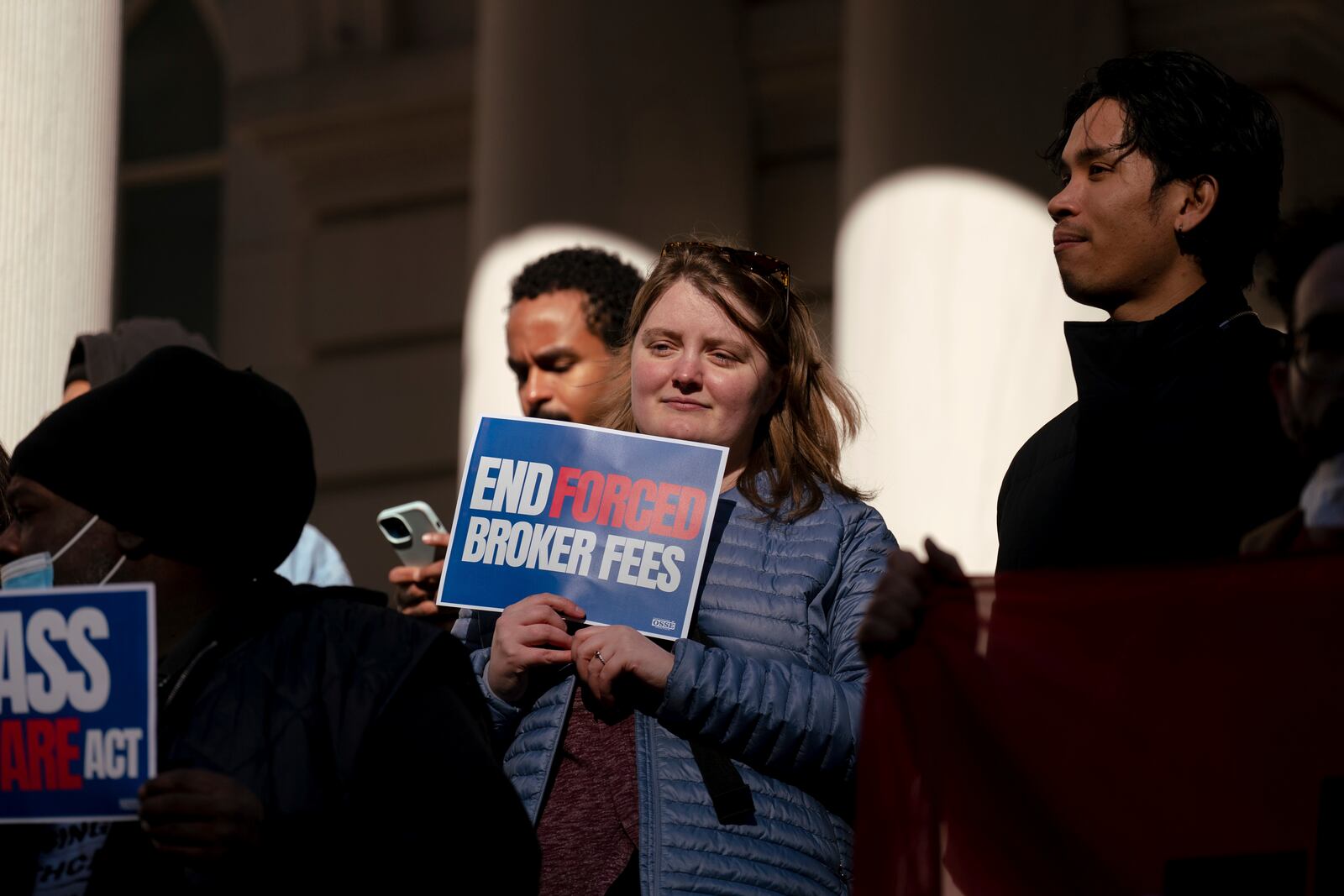 People gather outside of City Hall for a rally in support of the FARE Act ahead of a City Council meeting, Wednesday, Nov. 13, 2024, in New York. (AP Photo/Adam Gray)