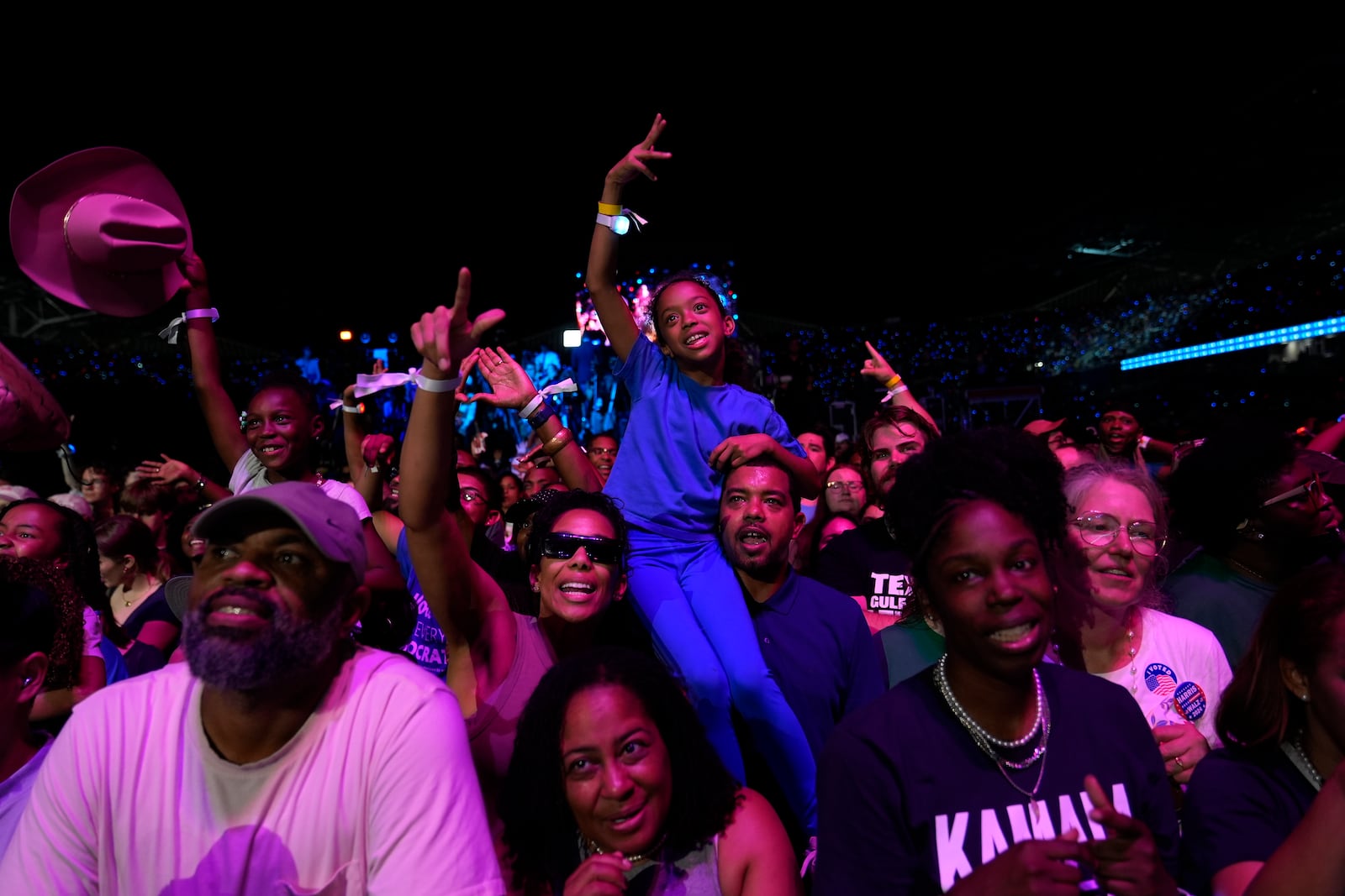 Supporters reacting as they wait for Democratic presidential nominee Vice President Kamala Harris to speak at a rally in Houston, Friday, Oct. 25, 2024. (AP Photo/Susan Walsh)