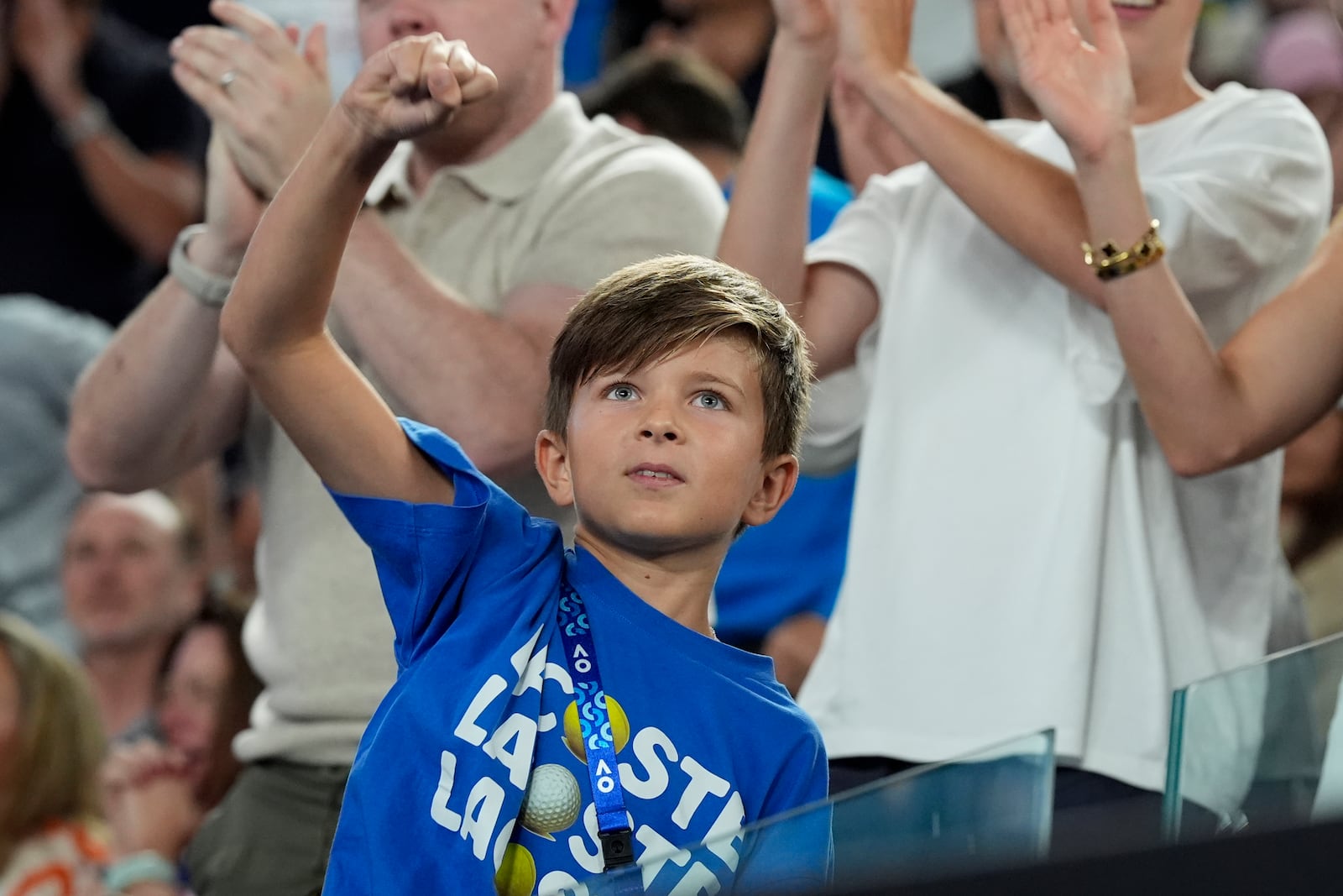 Stefan Djokovic reacts as he watches his father Novak Djokovic of Serbia in his quarterfinal match against Carlos Alcaraz of Spain at the Australian Open tennis championship in Melbourne, Australia, Tuesday, Jan. 21, 2025. (AP Photo/Asanka Brendon Ratnayake)