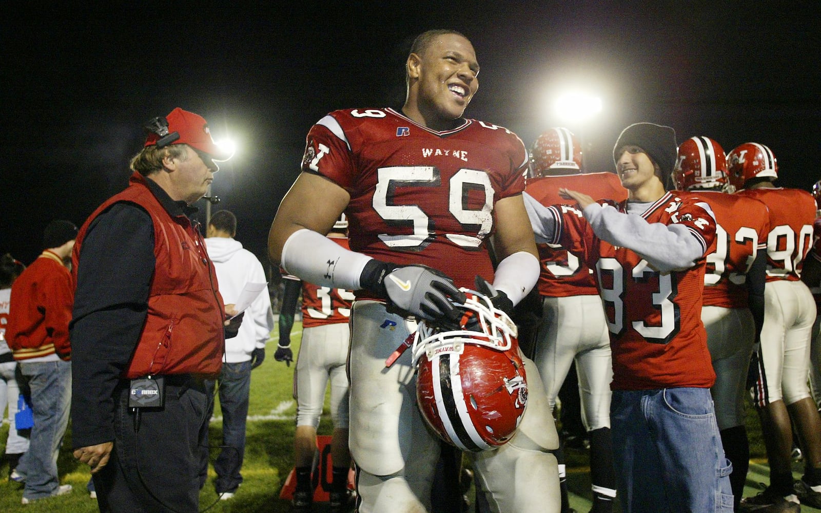 Wayne’s Jerel Worthy is congratulated on the sideline after the Warriors recover a first-half fumble against Centerville. Chris Stewart/DDN file