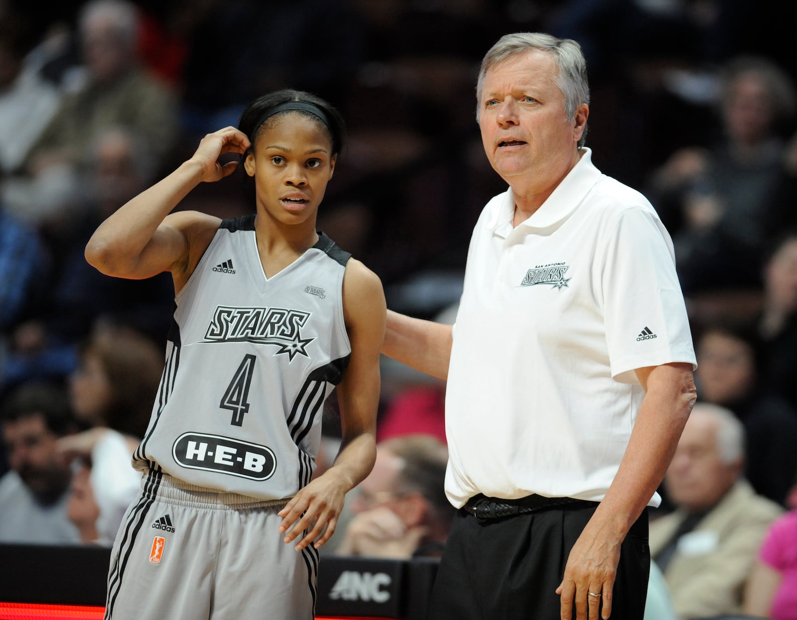 San Antonio Stars head coach Dan Hughes, right, talks San Antonio Stars' Moriah Jefferson, left, during the first half of a WNBA basketball game, Thursday, May 5, 2016, in Uncasville, Conn. (AP Photo/Jessica Hill)