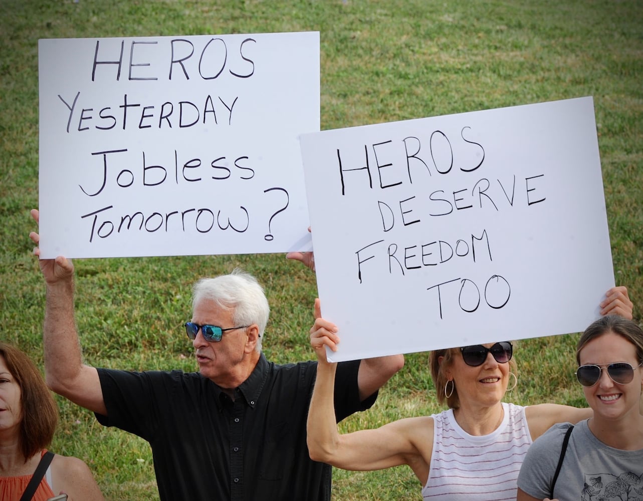 PHOTOS: Crowd gathers to protest COVID vaccine at Kettering Health