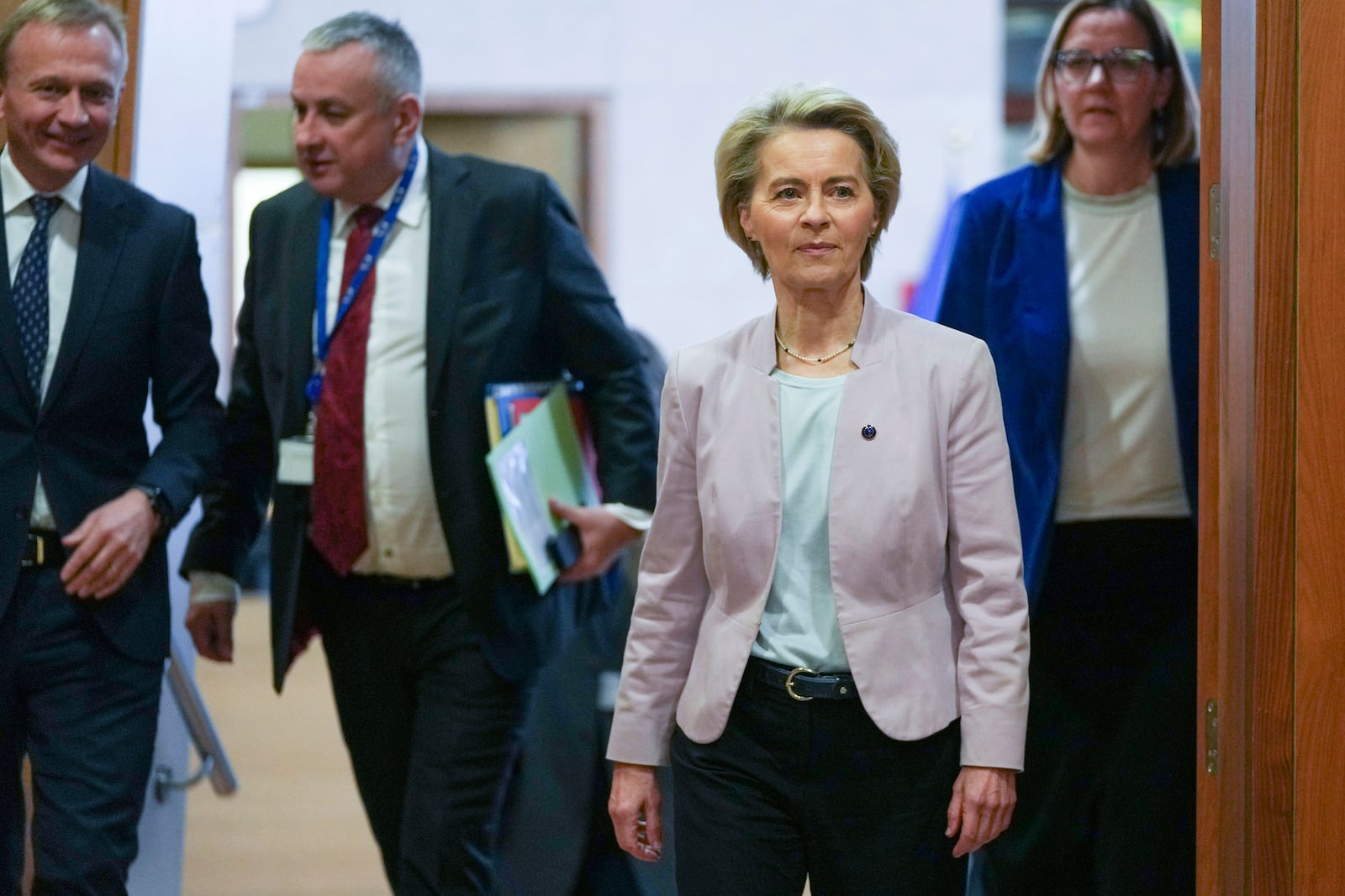 FILE - European Commission President Ursula von der Leyen, second right, arrives for the weekly College of Commissioners meeting at EU headquarters in Brussels, Feb. 5, 2025. (AP Photo/Virginia Mayo, file)