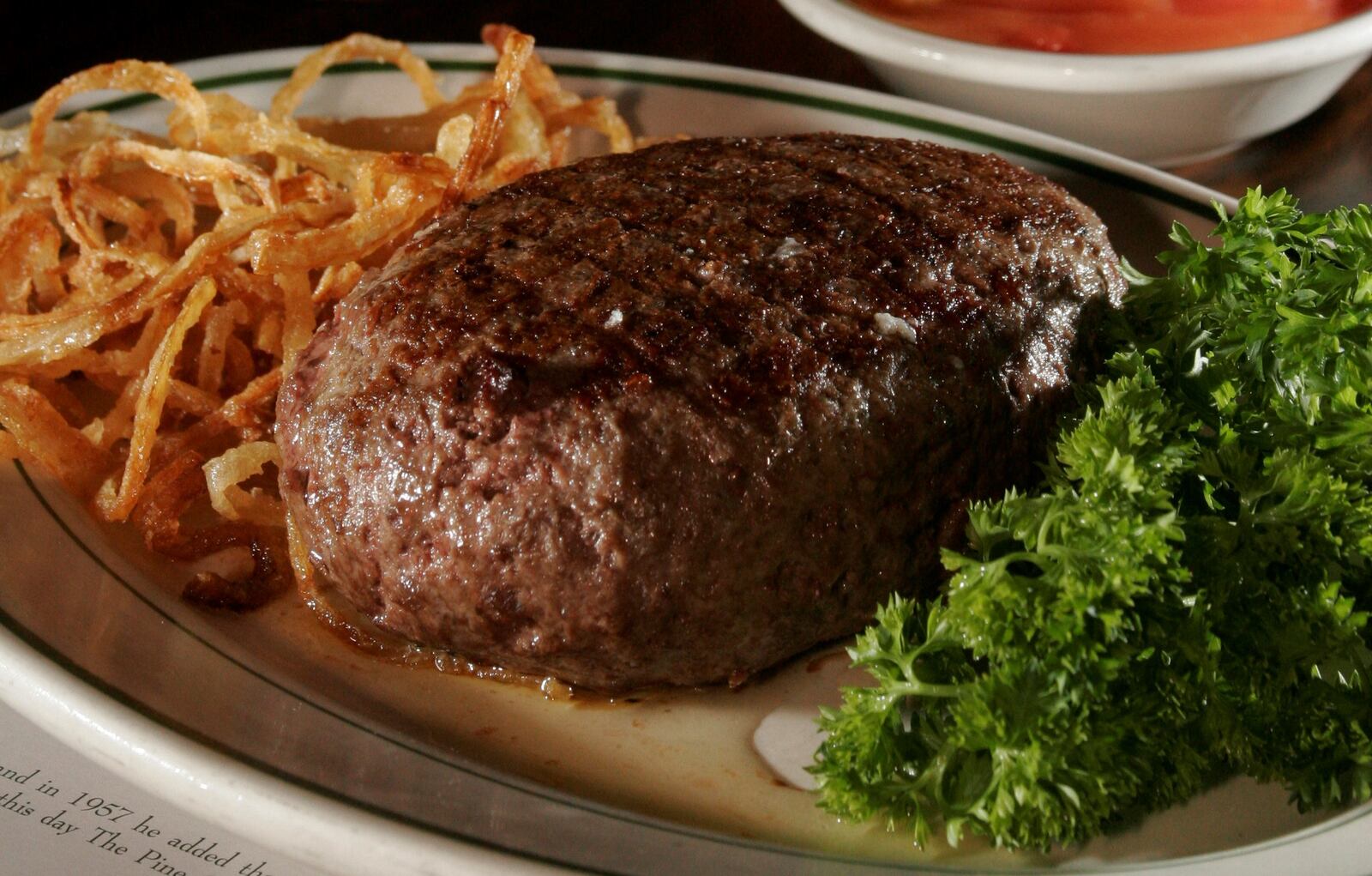 The Pine Club meal, including its signature onion rings. 2008 staff file photo by Lisa Powell