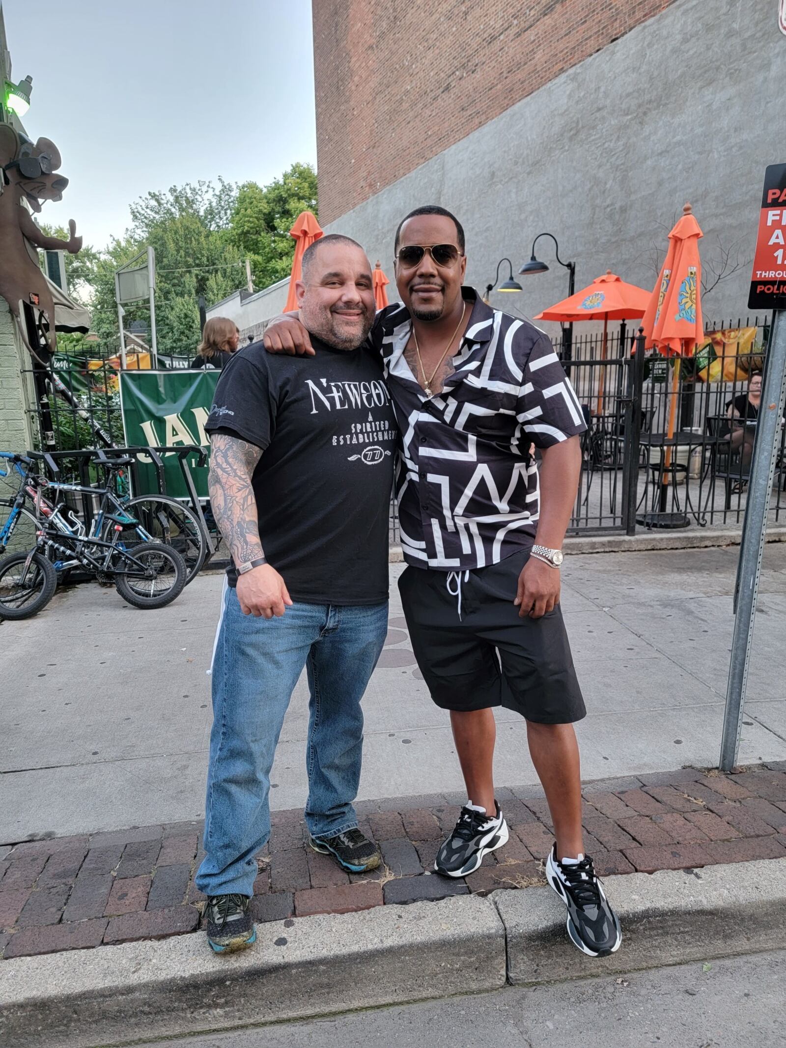 Jeremey Ganger with Dion Green in the Oregon District. Green’s father, 57-year-old Derrick Fudge died in his arms after being shot in the mass shooting along E. Fifth Street August 4, 2019. Green has since started the Fudge Foundation to address gun violence and aid victims, not only in the Miami Valley but across the nation. Green organized Friday night’s “Never Forget the 9” vigil in the Oregon District and Ganger was one of the featured speakers. CONTRIBUTED