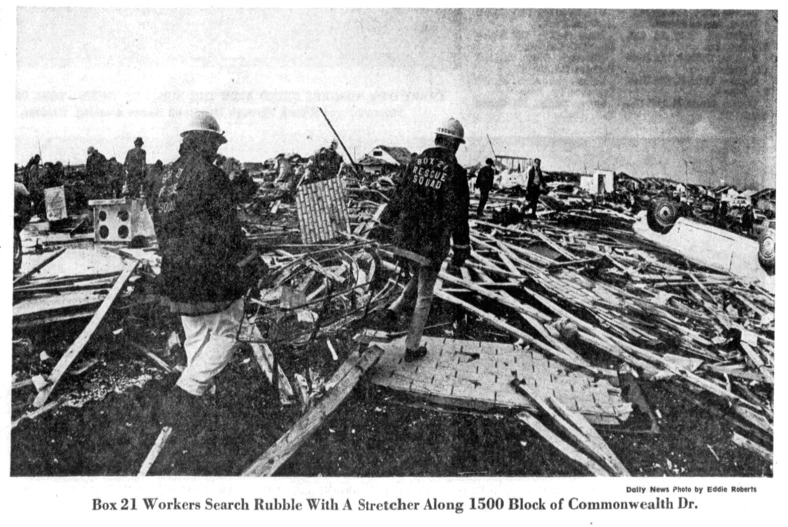 Box 21 workers search rubble with a stretcher along 1500 block of Commonwealth Dr. after the Xenia tornado of 1974. DAYTON DAILY NEWS ARCHIVES