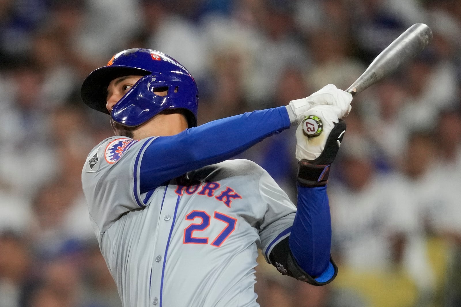 New York Mets' Mark Vientos hits a two-run home run during fourth inning of Game 6 in a baseball NL Championship Series against the Los Angeles Dodgers, Sunday, Oct. 20, 2024, in Los Angeles. (AP Photo/Ashley Landis)