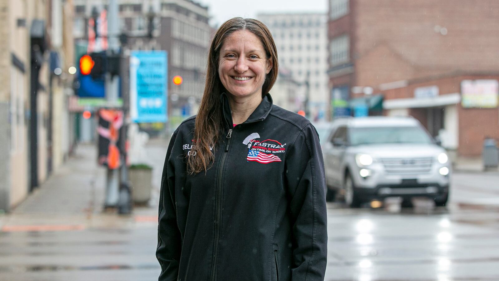 Condrey in downtown Middletown. Though she thought her skydiving career may be cut short, a minimally invasive spine surgery helped her get back into the air after an injury.