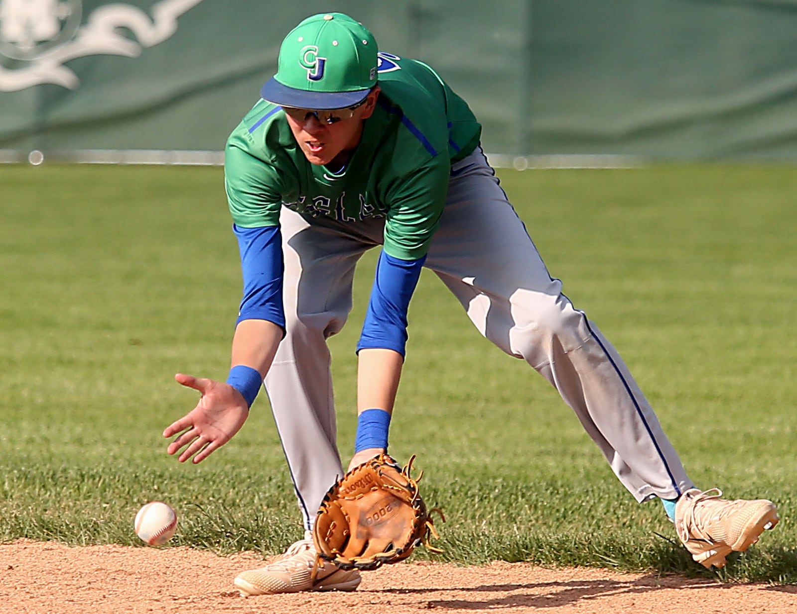 Chaminade Julienne second baseman Nick Wissman scoops up a Waynesville grounder during Friday’s Division II regional semifinal at Mason. CONTRIBUTED PHOTO BY E.L. HUBBARD