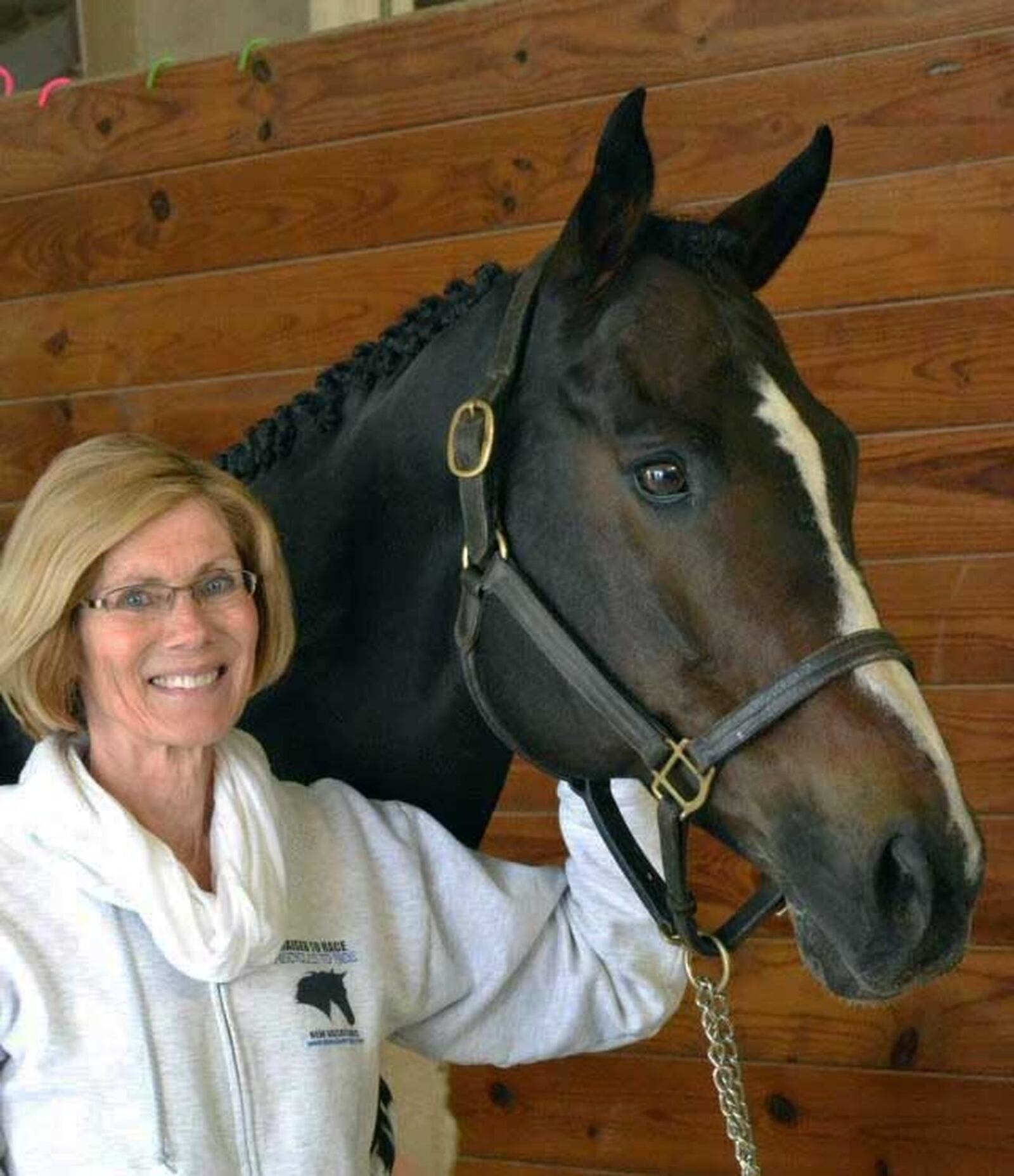 Dot Morgan with the Thoroughbred gelding Lively Dance. He was adopted in 2001 and lives in New York with his owner, Lizzie Allers. Photo courtesy of New Vocations