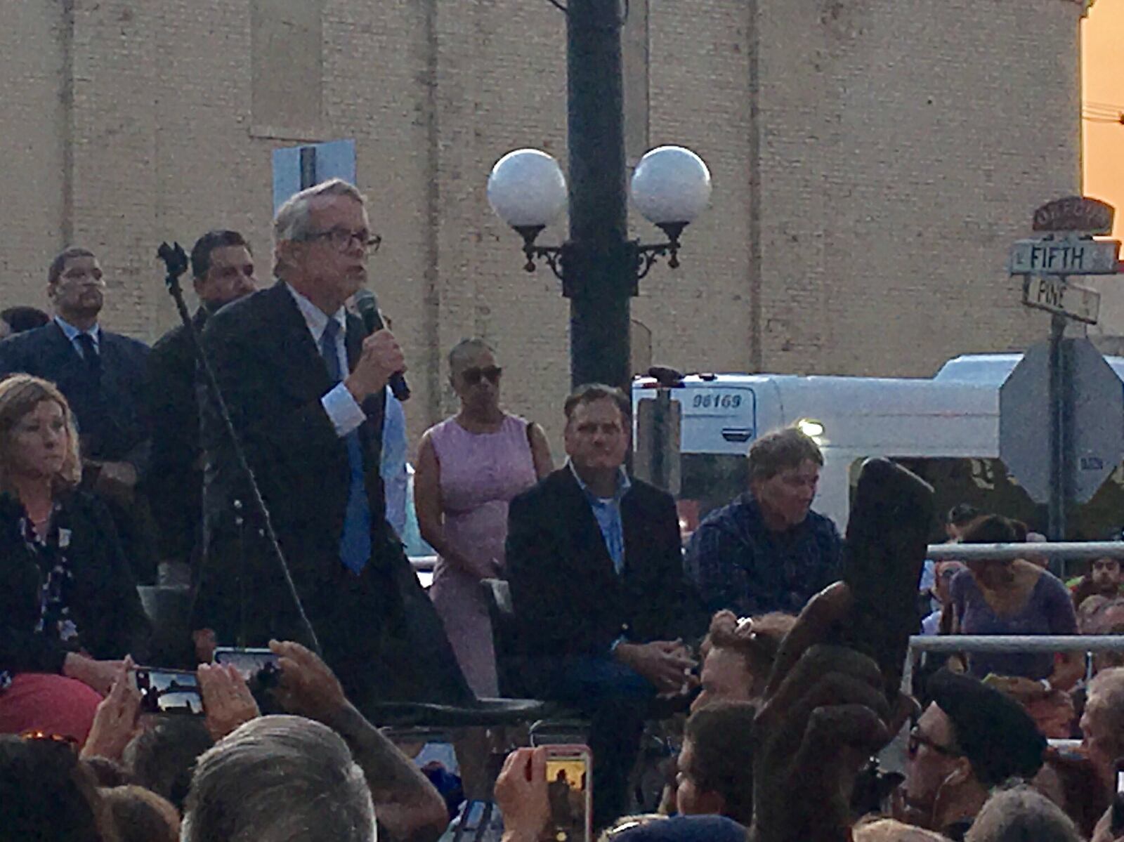 Gov. Mike DeWine speaks at a vigil for victims and survivors of the August 2019 shooting in Dayton’s Oregon District. The governor was met with shouts of “Do something” from the crowd, amid frustration over continuing mass shootings.