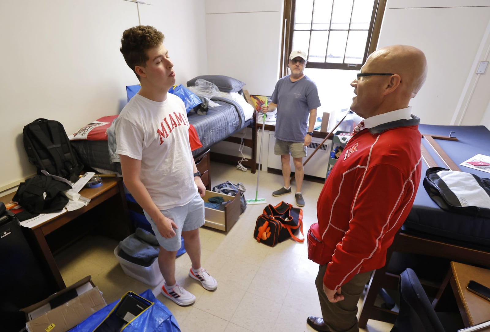 Spencer Bersh is greeted by Miami University President Greg Crawford during move in at Morris Hall Friday, Aug. 23, 2024 at Miami University in Oxford. The university now has 18, 838 students attending, a 1.2% increase from last year. NICK GRAHAM/STAFF