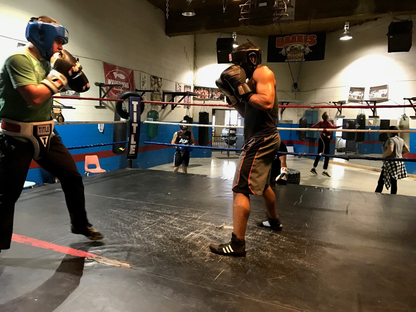 Quincy Hazard (black shirt) an up and coming amateur boxer, spars at Drake’s Downtown Gym with Sam Wildenhaus, an accomplished boxer from Yellow Springs with a 4-1 professional record. Tom Archdeacon/CONTRIBUTED