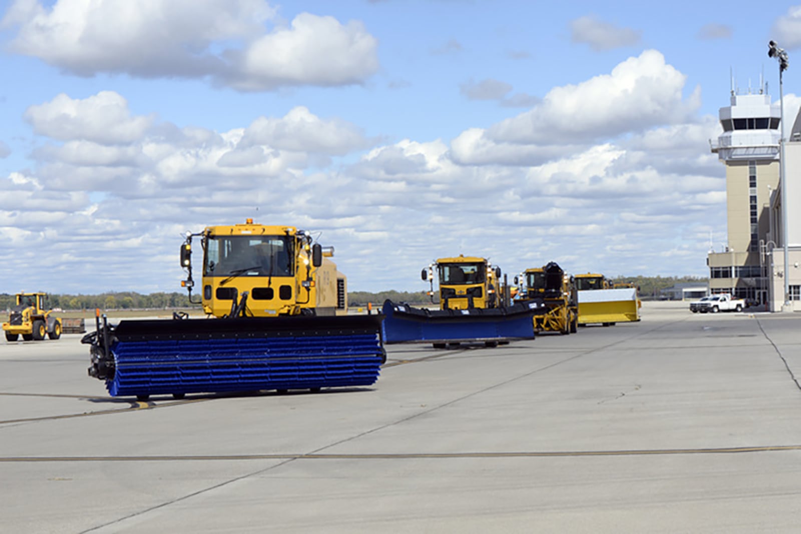 Heavy equipment operators from the 88th Civil Engineer Group parade snow removal equipment across the airfield ramp at Wright-Patterson Air Force Base last October. U.S. AIR FORCE PHOTO/TY GREENLEES