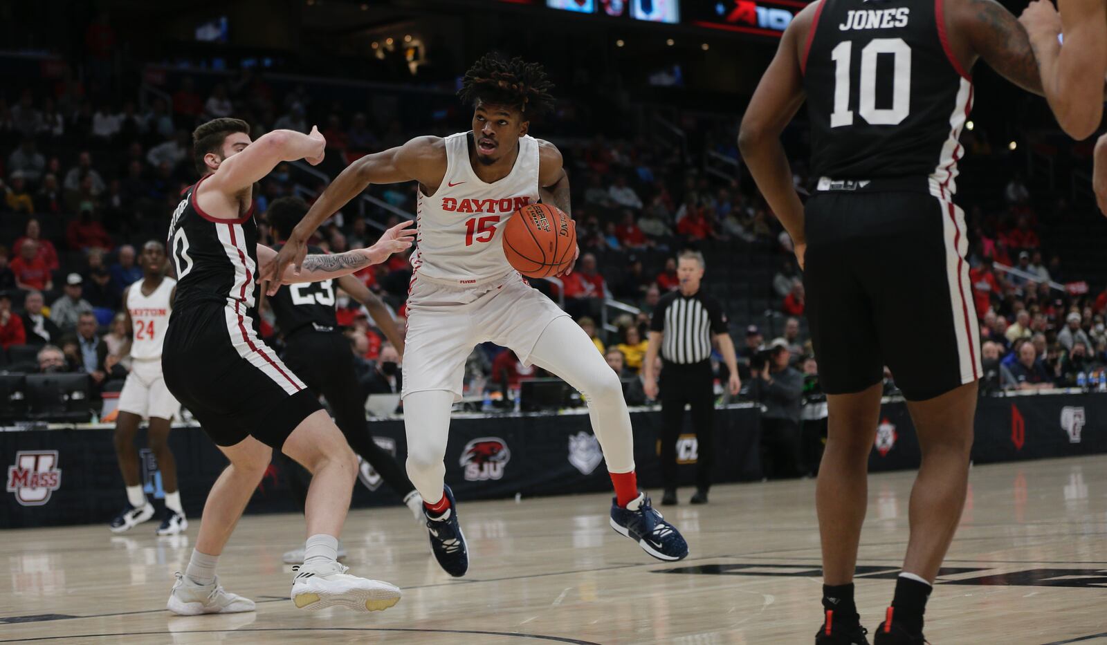 Dayton's DaRon Holmes II looks for a shot against Massachusetts in the first half in the Atlantic 10 Conference quarterfinals on Friday, March 11, 2022, at Capital One Arena in Washington, D.C. David Jablonski/Staff