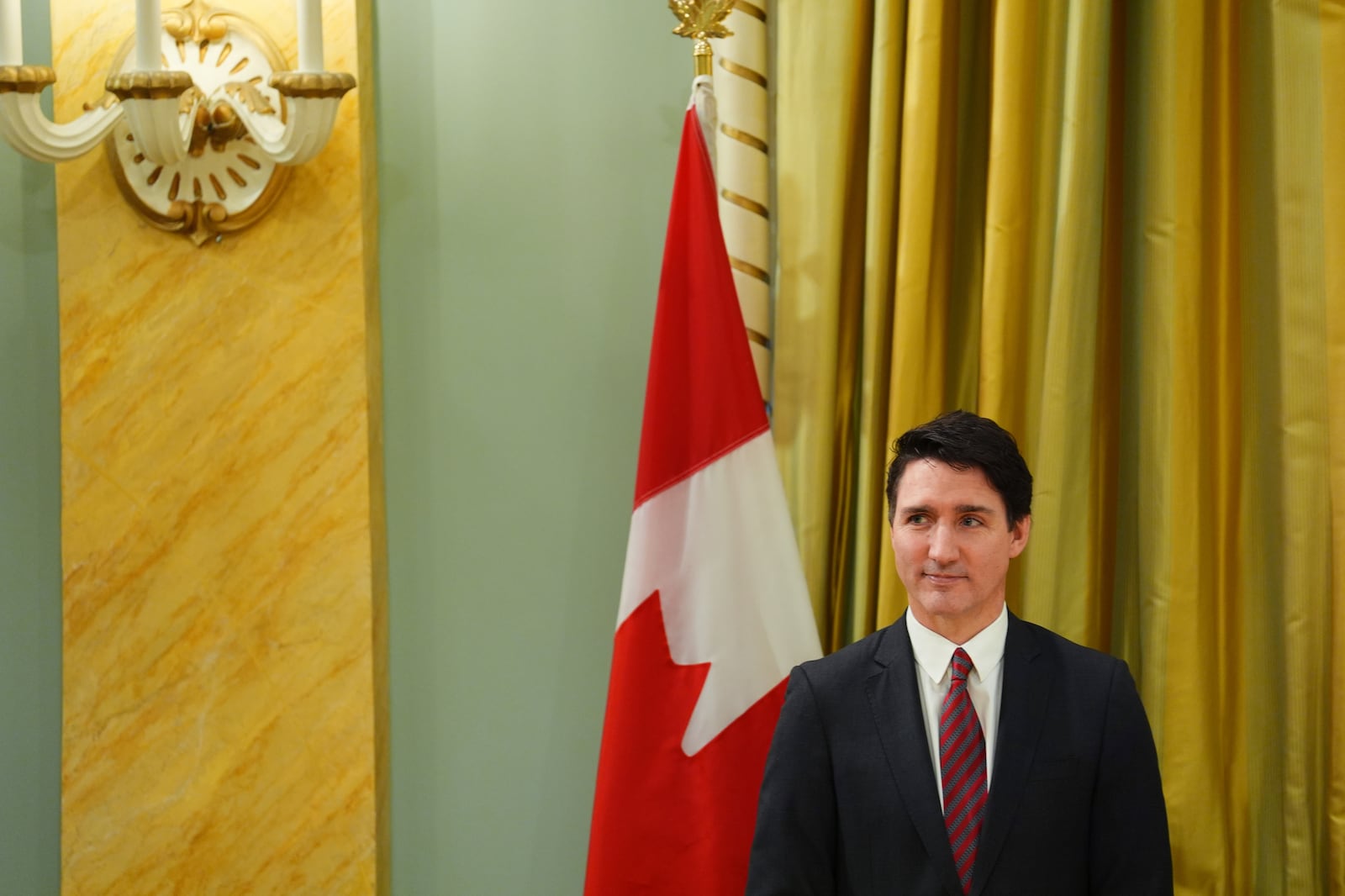 Prime Minister Justin Trudeau looks on during a cabinet swearing-in ceremony at Rideau Hall in Ottawa, on Friday, Dec.20, 2024.(Sean Kilpatrick /The Canadian Press via AP)