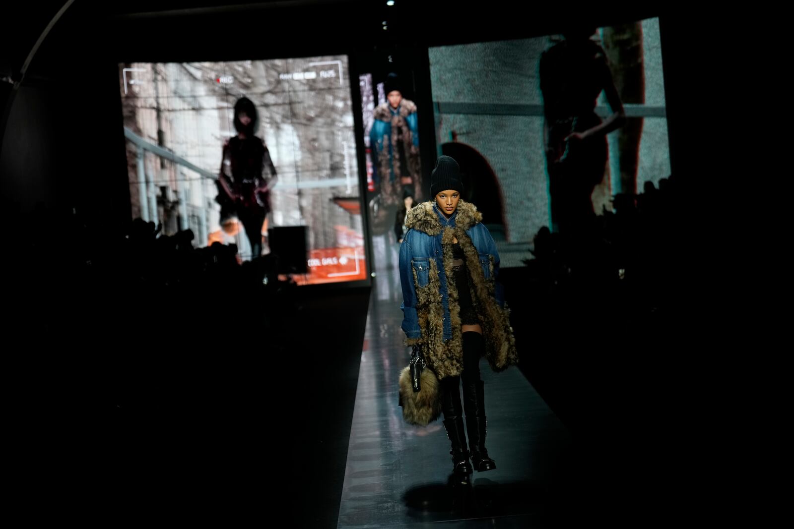 Models wear creations as part of the Dolce&Gabbana's Fall/Winter 2025-2026 collection presented in Milan, Italy, Saturday, March 1, 2025. (AP Photo/Luca Bruno)