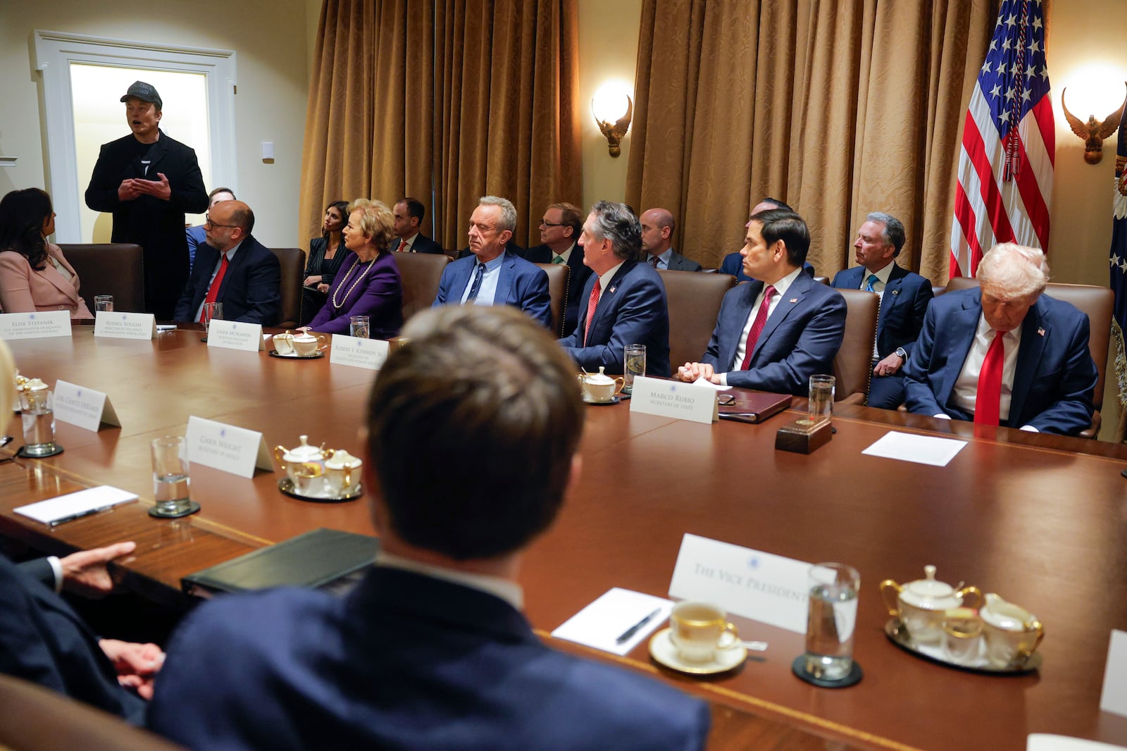 Elon Musk speaks as President Donald Trump holds a Cabinet meeting at the White House in Washington, Tuesday, Feb. 26, 2025. (Pool via AP)