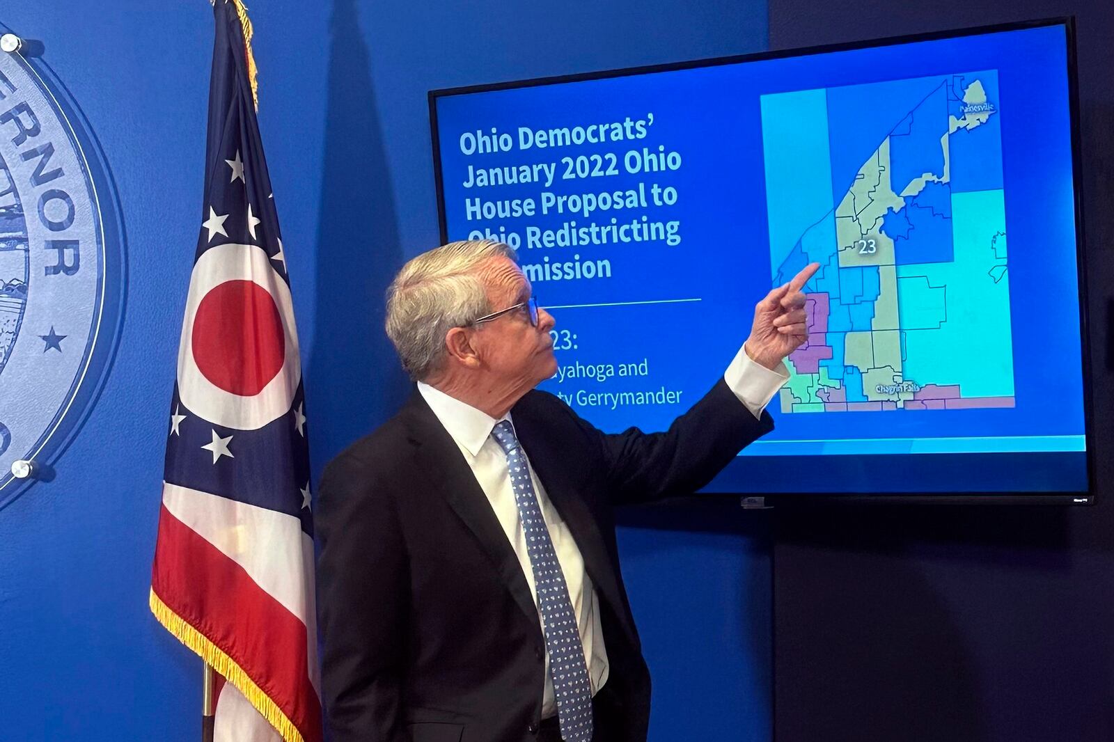 Ohio Gov. Mike DeWine points to a map during a press conference in Columbus, Ohio, Wednesday, July 31, 2024, where he opposed a fall ballot measure aimed at remaking the state's troubled political mapmaking system. If it passes, DeWine said he will work with state lawmakers next year to advance a competing amendment based on the Iowa model. (AP Photo/Julie Carr Smyth)