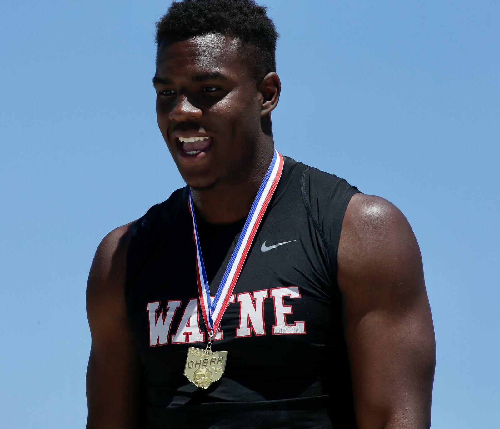 Wayne's Aamil Wagner stands on the podium after winning a Division I state championship in the shot put on Saturday, June 4, 2022, at Jesse Owens Memorial Stadium in Columbus. David Jablonski/Staff