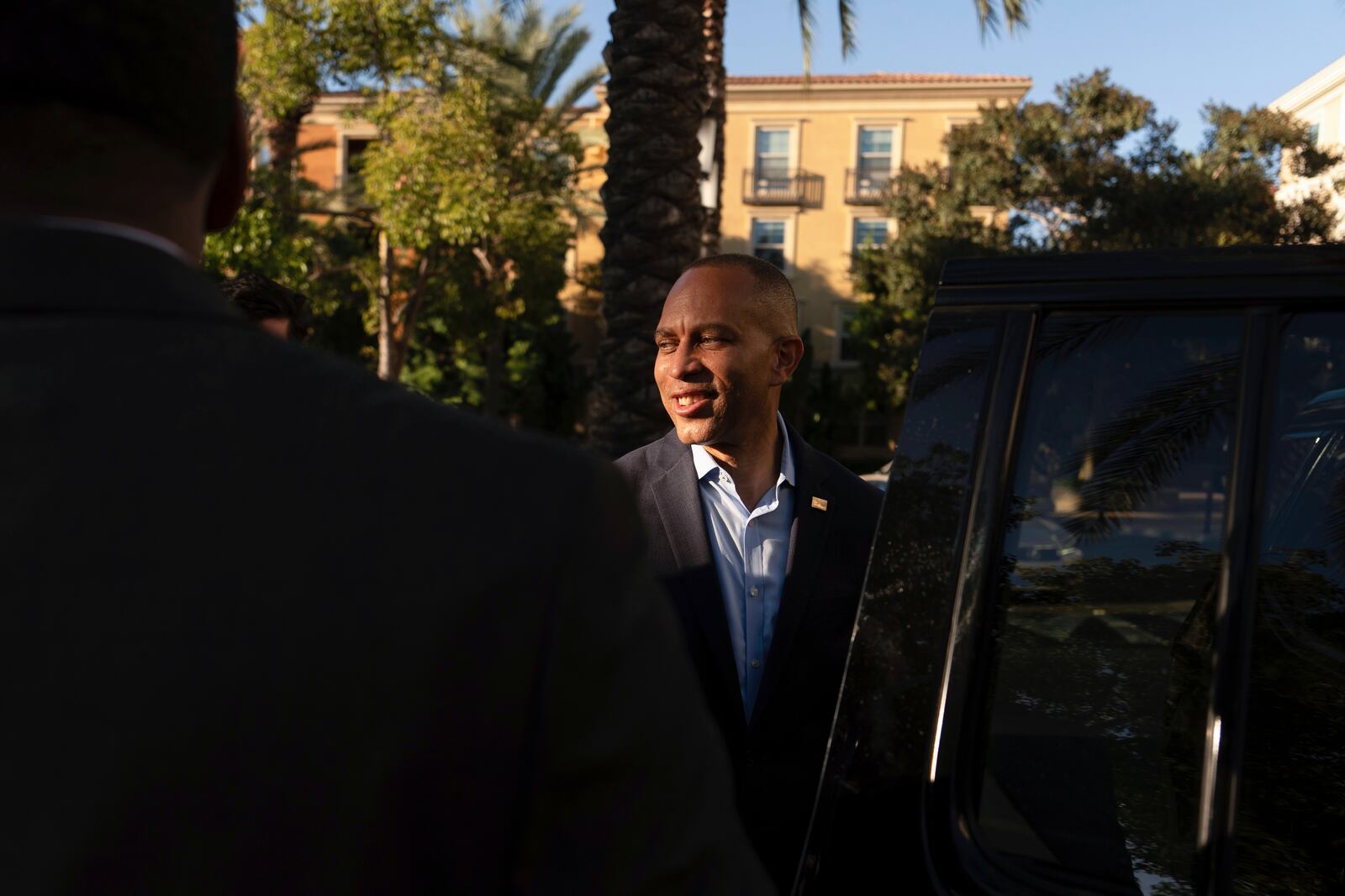 House Minority Leader Hakeem Jeffries, D-N.Y., center, departs following an interview with The Associated Press, Saturday, Oct. 12, 2024, in Irvine, Calif. (AP Photo/Julia Demaree Nikhinson)