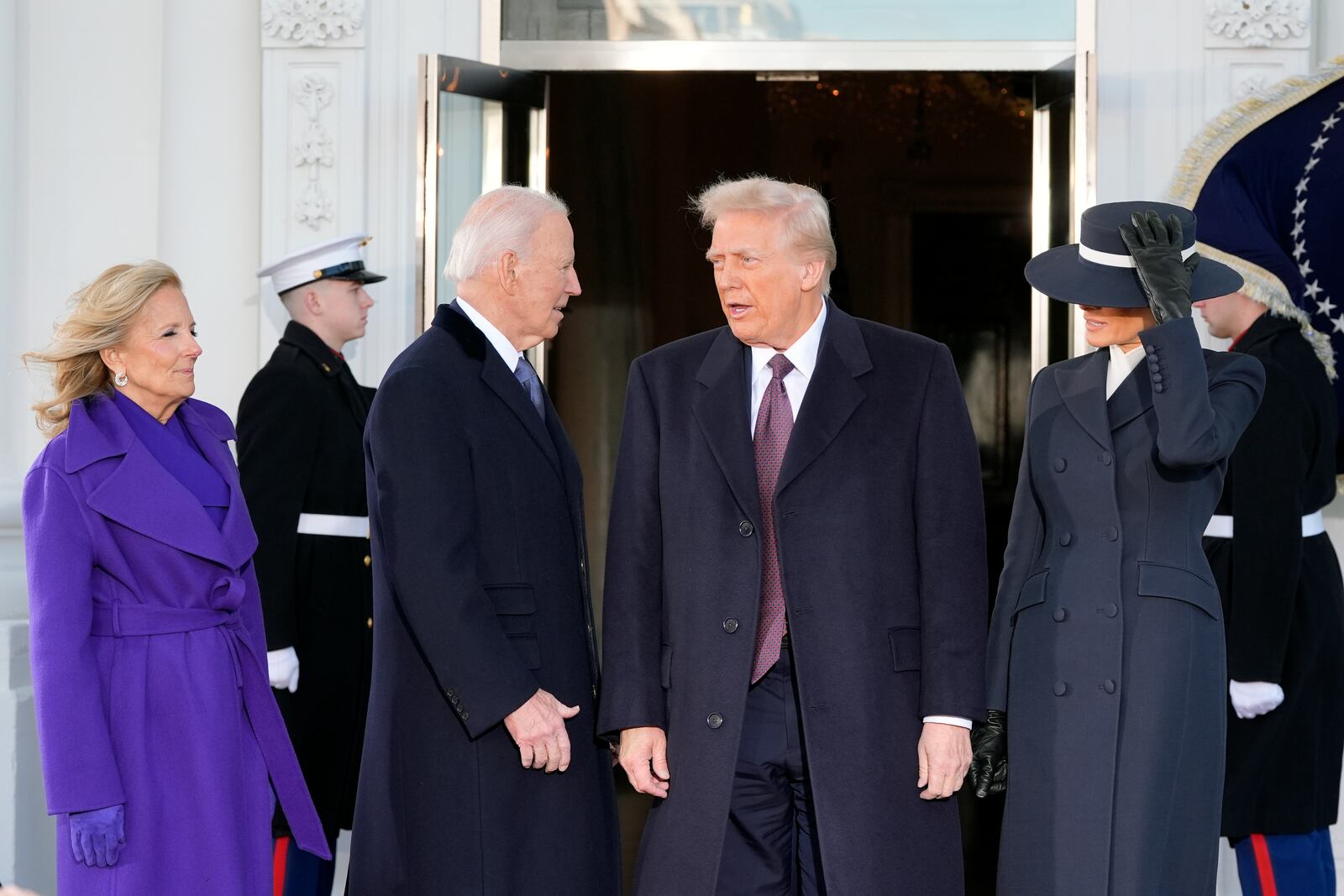 President-elect Donald Trump and Melania Trump are greeted by President Joe Biden and first lady Jill Biden, upon their arrival at the White House, Monday, Jan. 20, 2025, in Washington. (AP Photo/Alex Brandon)