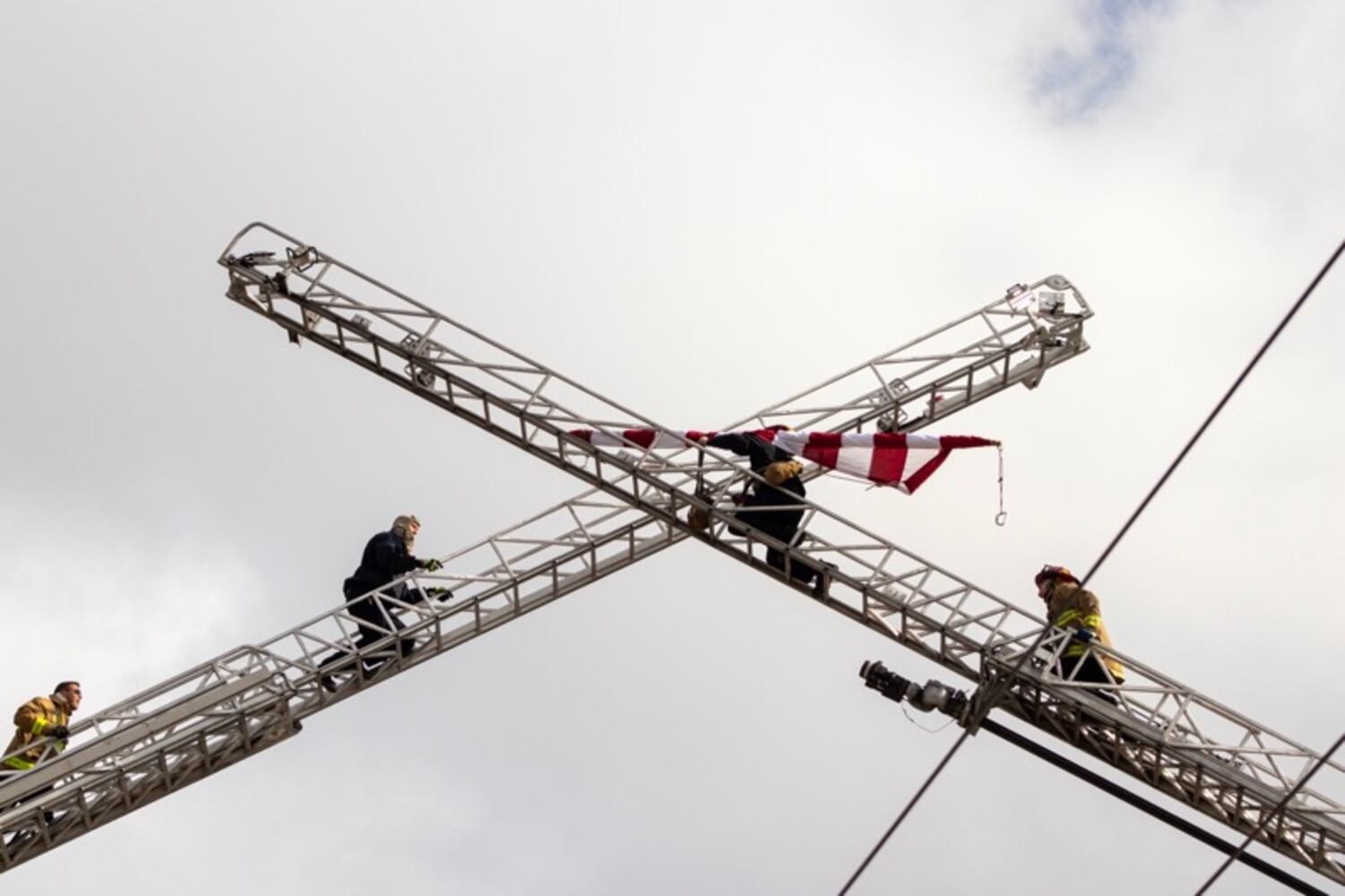 Firefighters put U.S. flag across Third Street