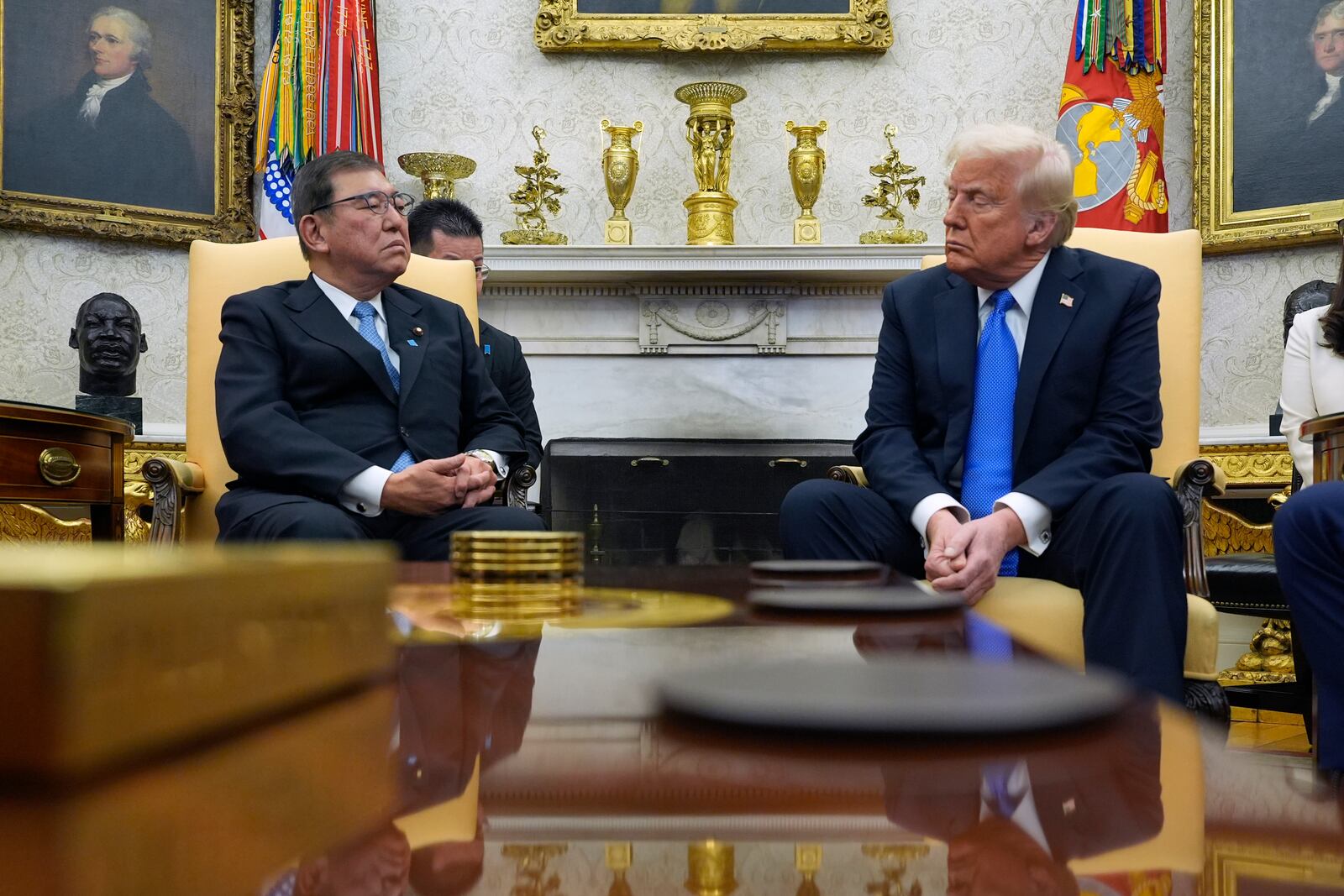 President Donald Trump speaks with Japanese Prime Minister Shigeru Ishiba in the Oval Office of the White House, Friday, Feb. 7, 2025, in Washington. (AP Photo/Alex Brandon)