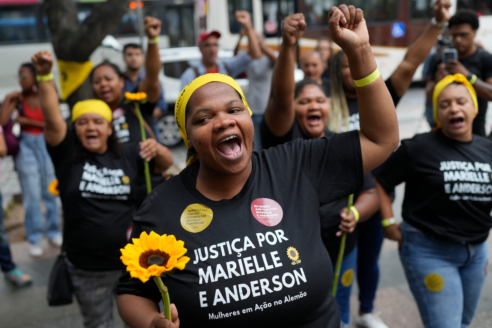 Activists attend a rally prior to the trial of former Rio de Janeiro city councilwoman Marielle Franco's alleged killers outside the Court of Justice, in Rio de Janeiro, Wednesday, Oct. 30, 2024. (AP Photo/Silvia Izquierdo)