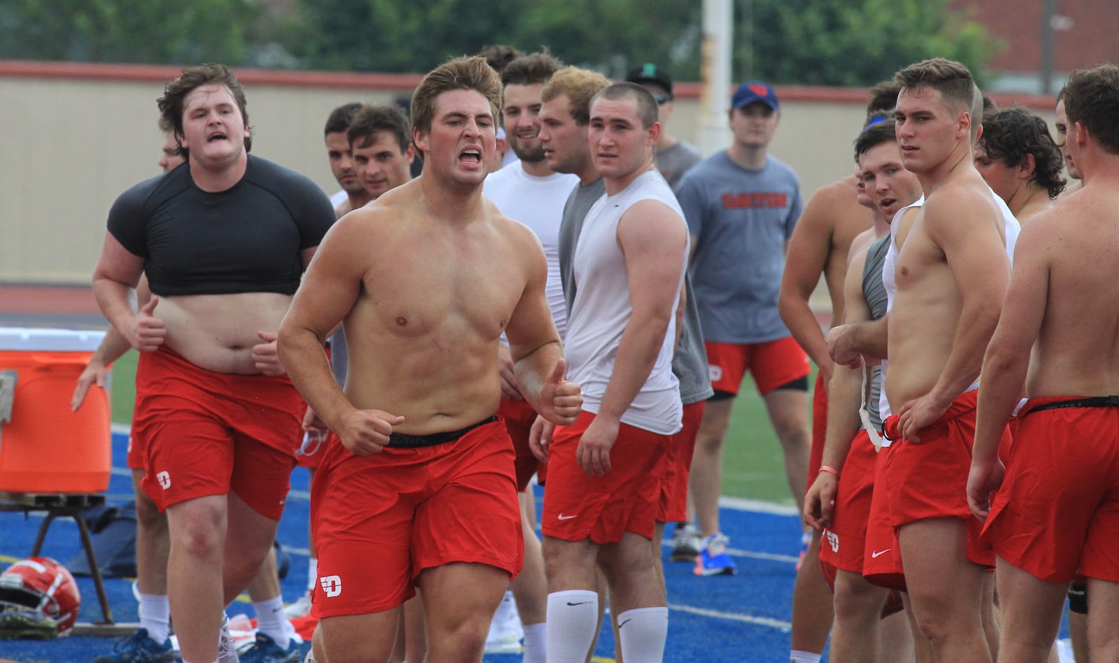 Freshman defensive tackle Nate Hess completes the mile in 6 minutes, 33 seconds on the track at Welcome Stadium after the first practice of the season on Monday, Aug. 9, 2021, in Dayton. Hess had the fastest time of any lineman. The one-mile run tradition goes back decades with the program. David Jablonski/Staff