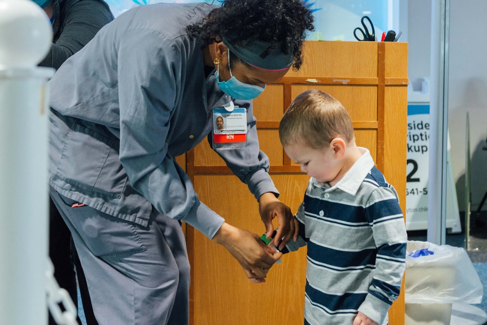 A nurse at the Dayton Children’s Hospital screens a young visitor for COVID-19 before he’s allowed to enter the facility on a recent afternoon. Dayton Children’s and other hospitals in the region require that anyone who enters their facilities be screened for the virus. CONTRIBUTED