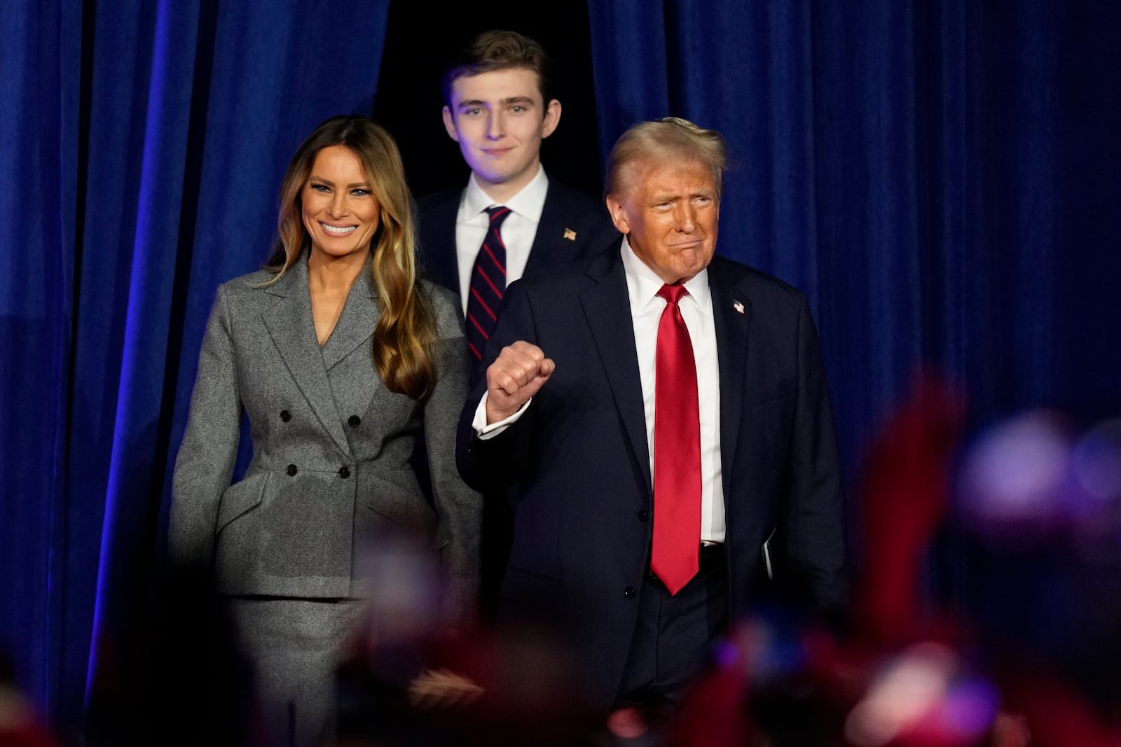 FILE - Republican presidential nominee former President Donald Trump, joined by wife Melania Trump, left, and son Barron Trump, arrives to speak at an election night watch party, Nov. 6, 2024, in West Palm Beach, Fla. (AP Photo/Alex Brandon, File)